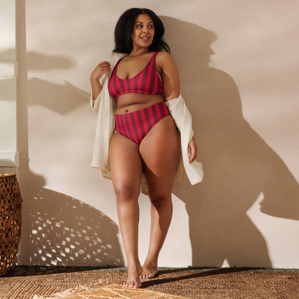 A plus-size woman wearing a women’s deep red stripe recycled two-piece bikini with upf 50+ quick drying fabric