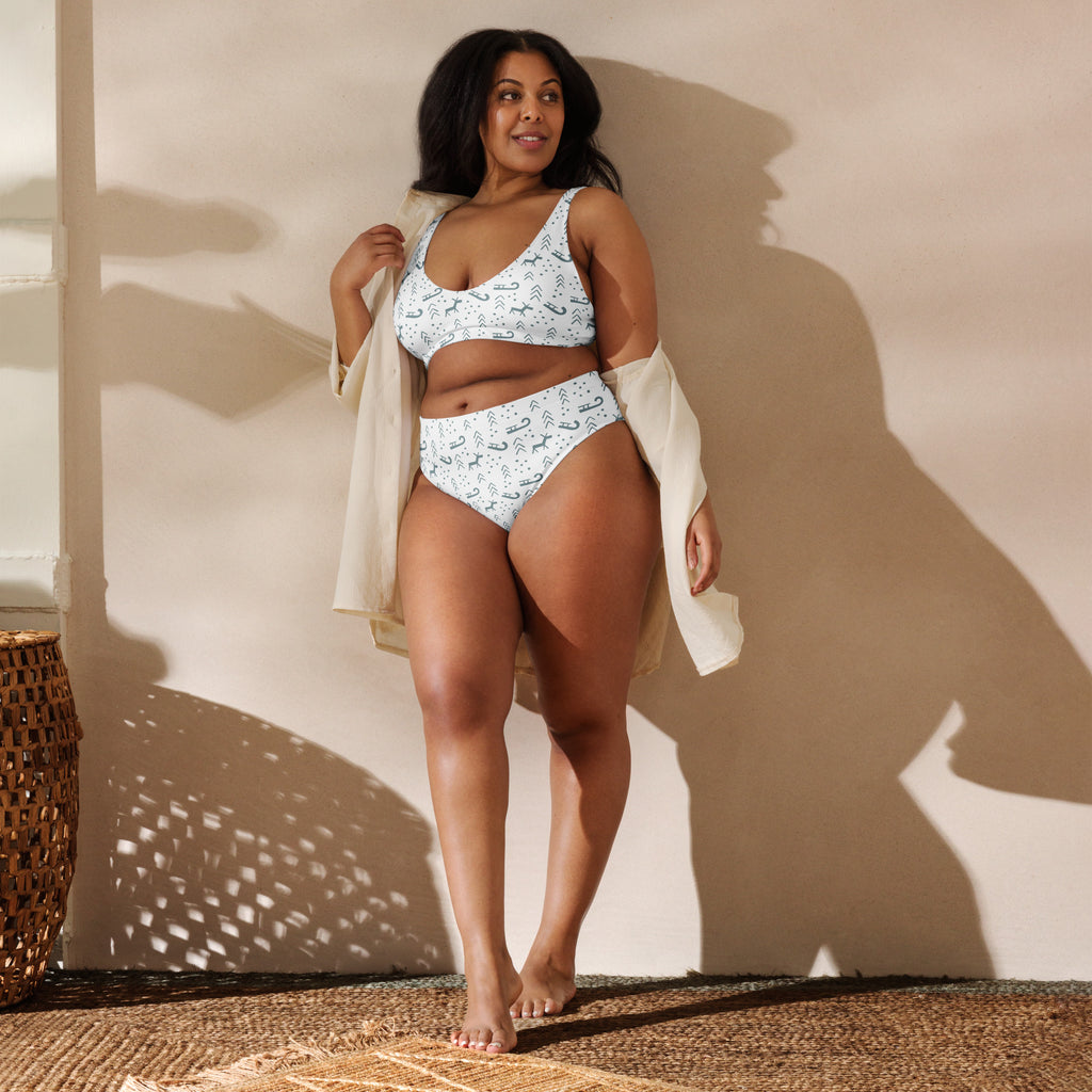 White bikini set with playful black mustache pattern made from quick drying recycled fabric with UPF 50 plus protection