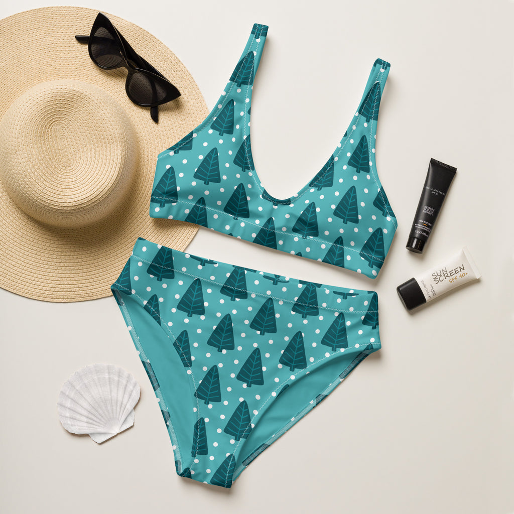Women’s teal two-piece swimsuit with dark green tree and white polka dot pattern made from quick drying recycled fabric with upf 50+