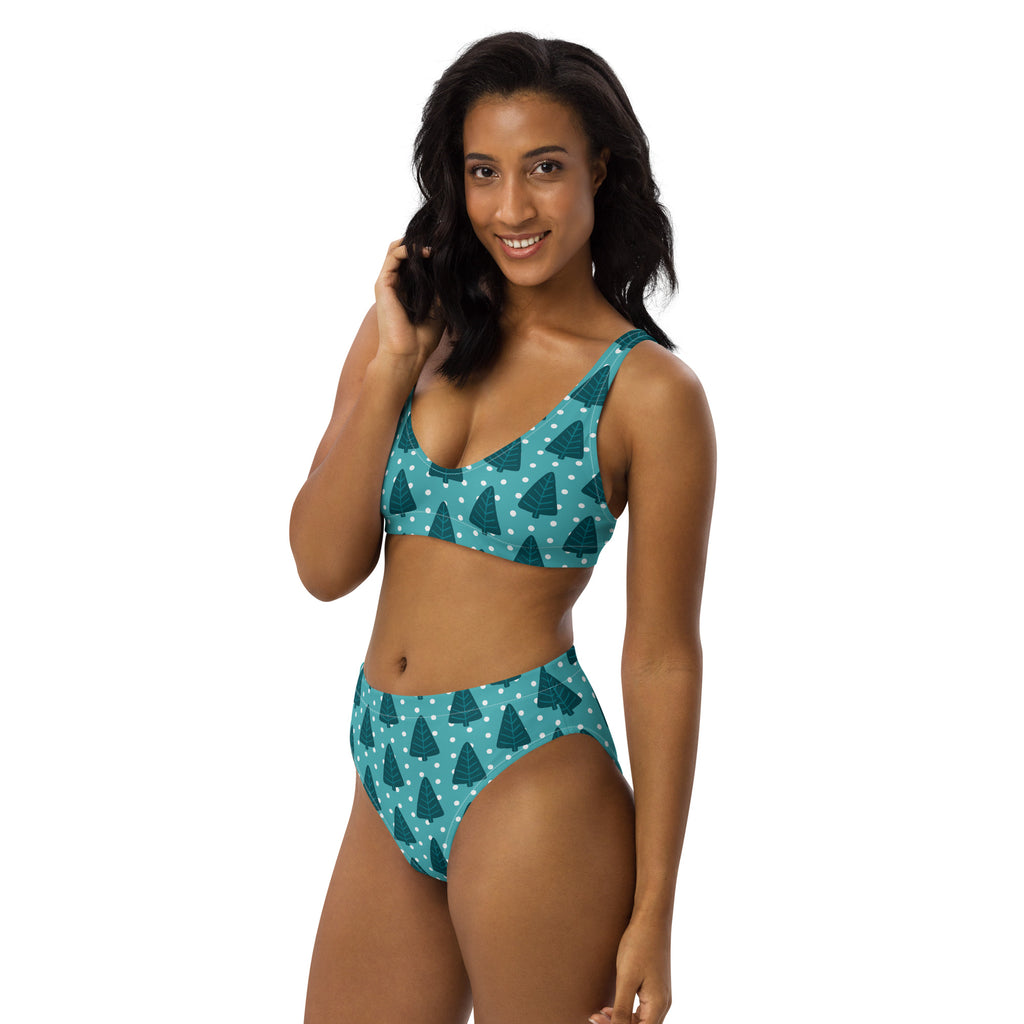 Women’s teal two-piece bikini set with dark pine tree pattern and white polka dots made from quick-drying recycled fabric with UPF 50+