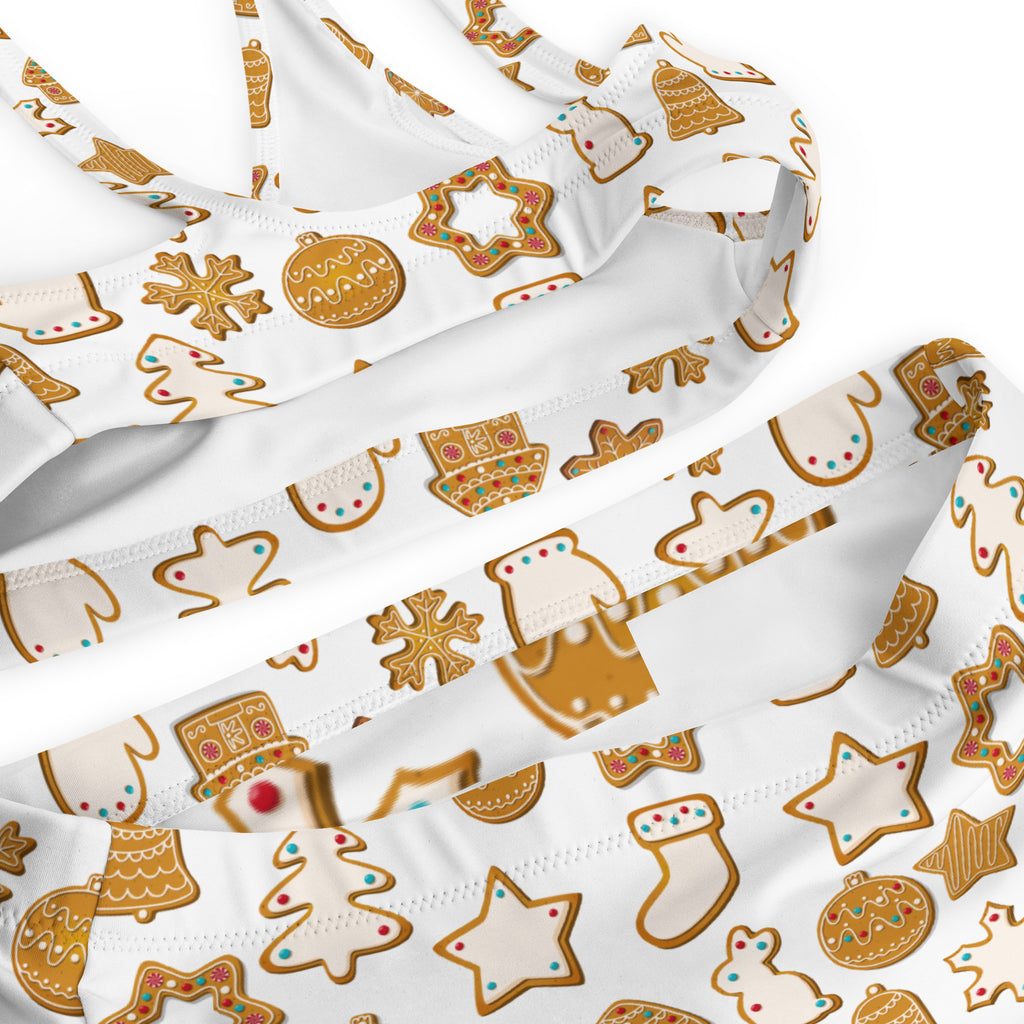 Women’s white gingerbread christmas recycled bikini top with festive pattern gold outlines and quick drying fabric upf 50+