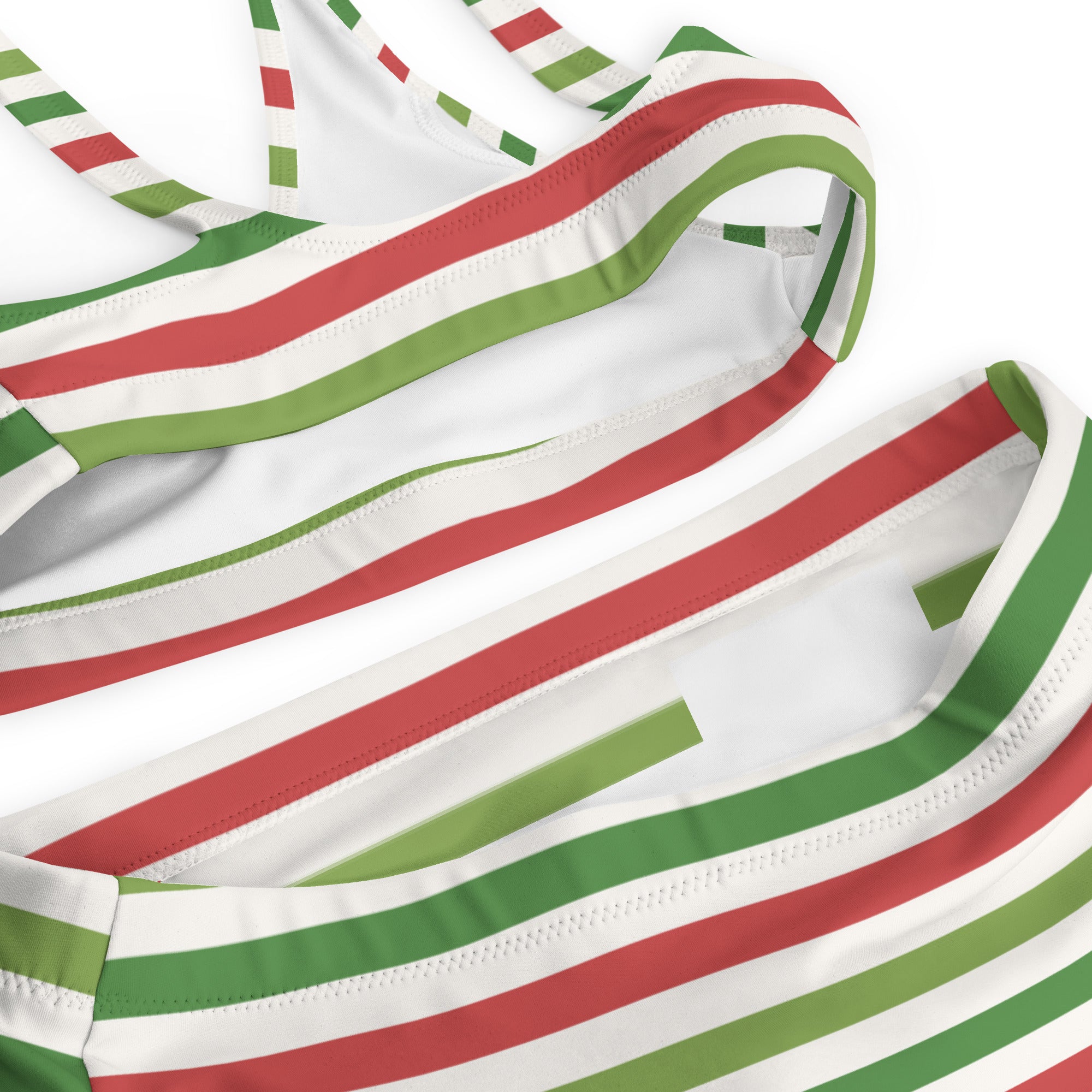 Women’s christmas stripe recycled bikini top in white with red and green stripes made of quick drying stretchy fabric with upf 50+