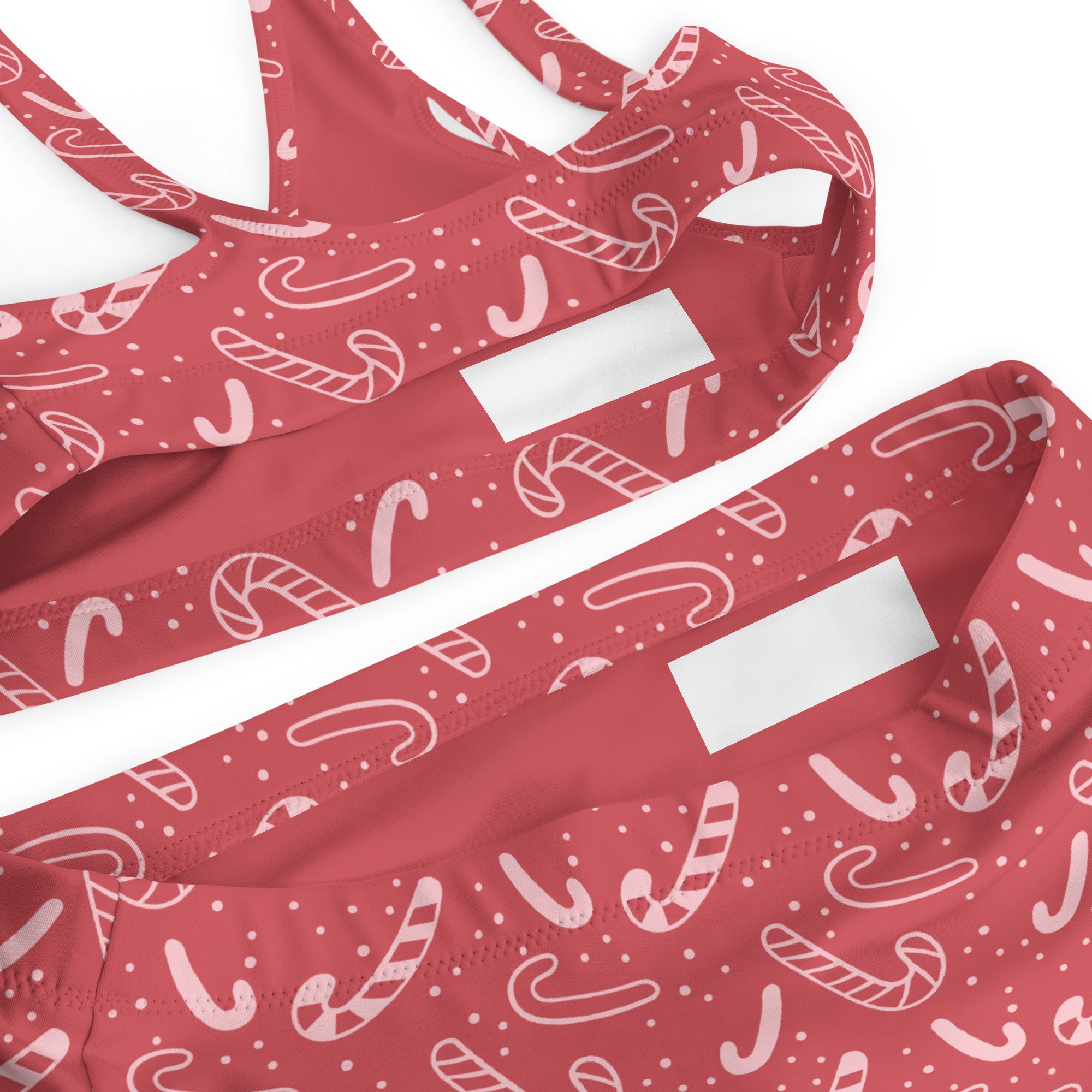 Women’s red candy cane patterned recycled bikini set with white outlines and dotted accents quick drying fabric upf 50+