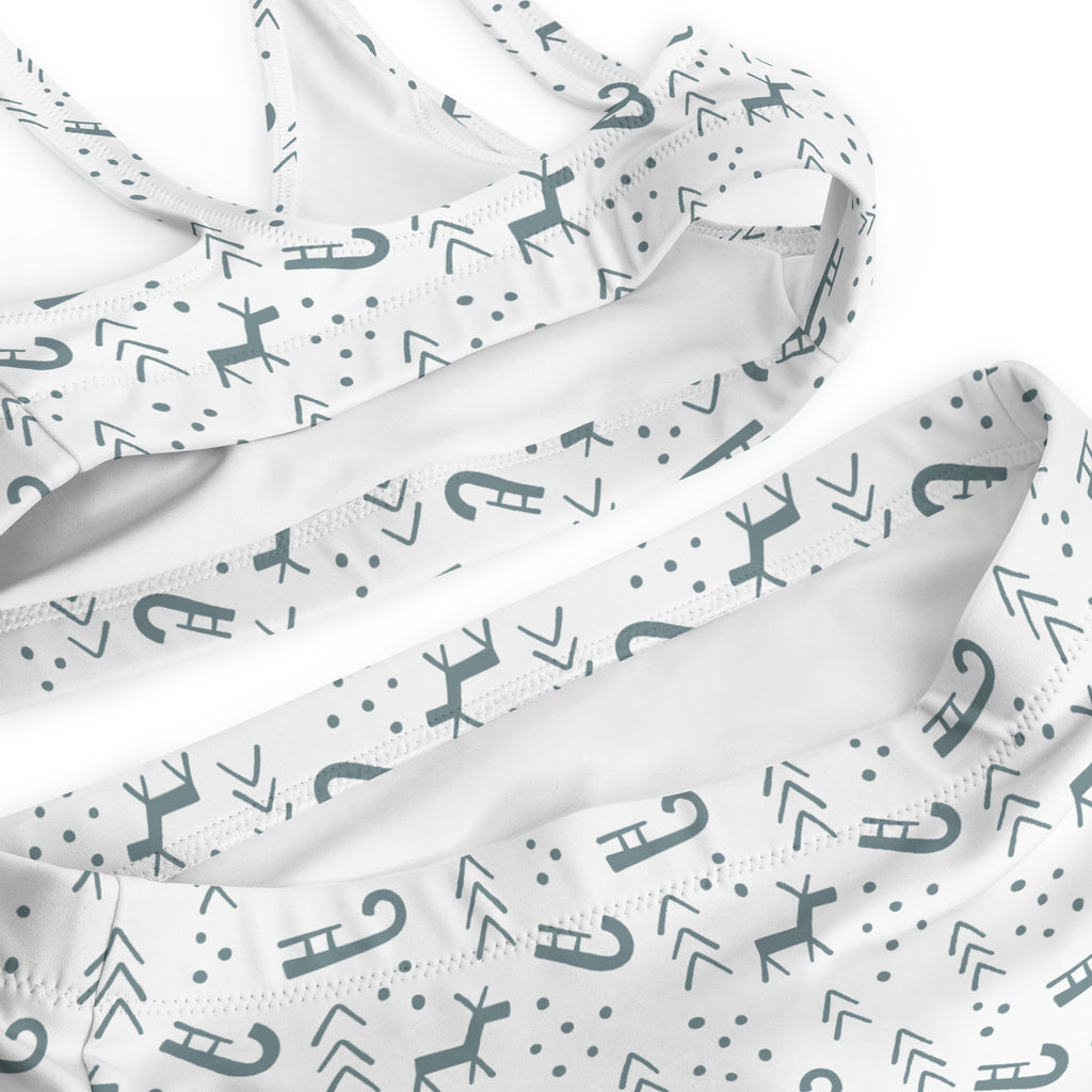 White bikini top with gray deer arrows and dots pattern made from quick drying recycled fabric with upf 50+ for winter use