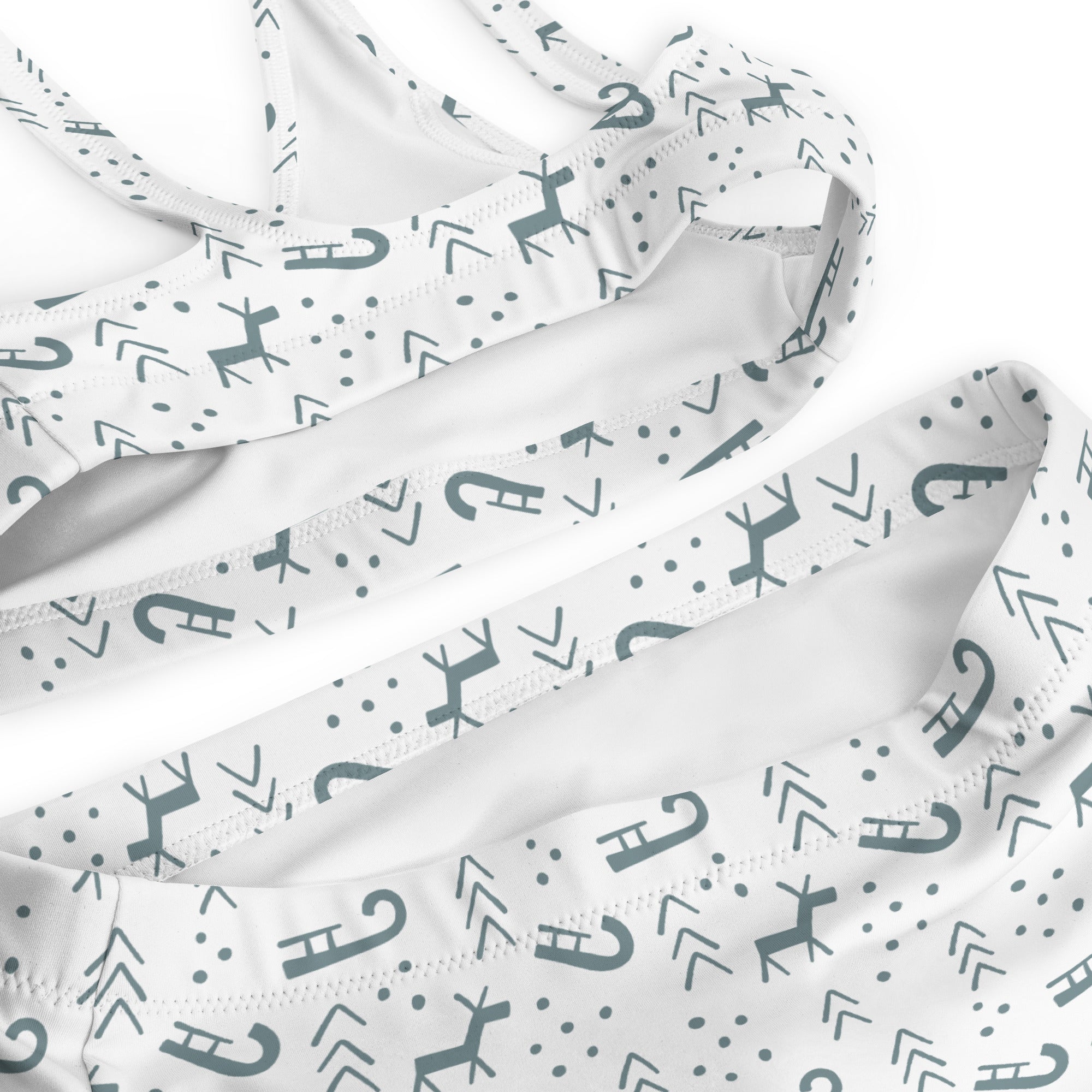 White bikini top with gray deer arrows and dots pattern made from quick drying recycled fabric with upf 50+ for winter use