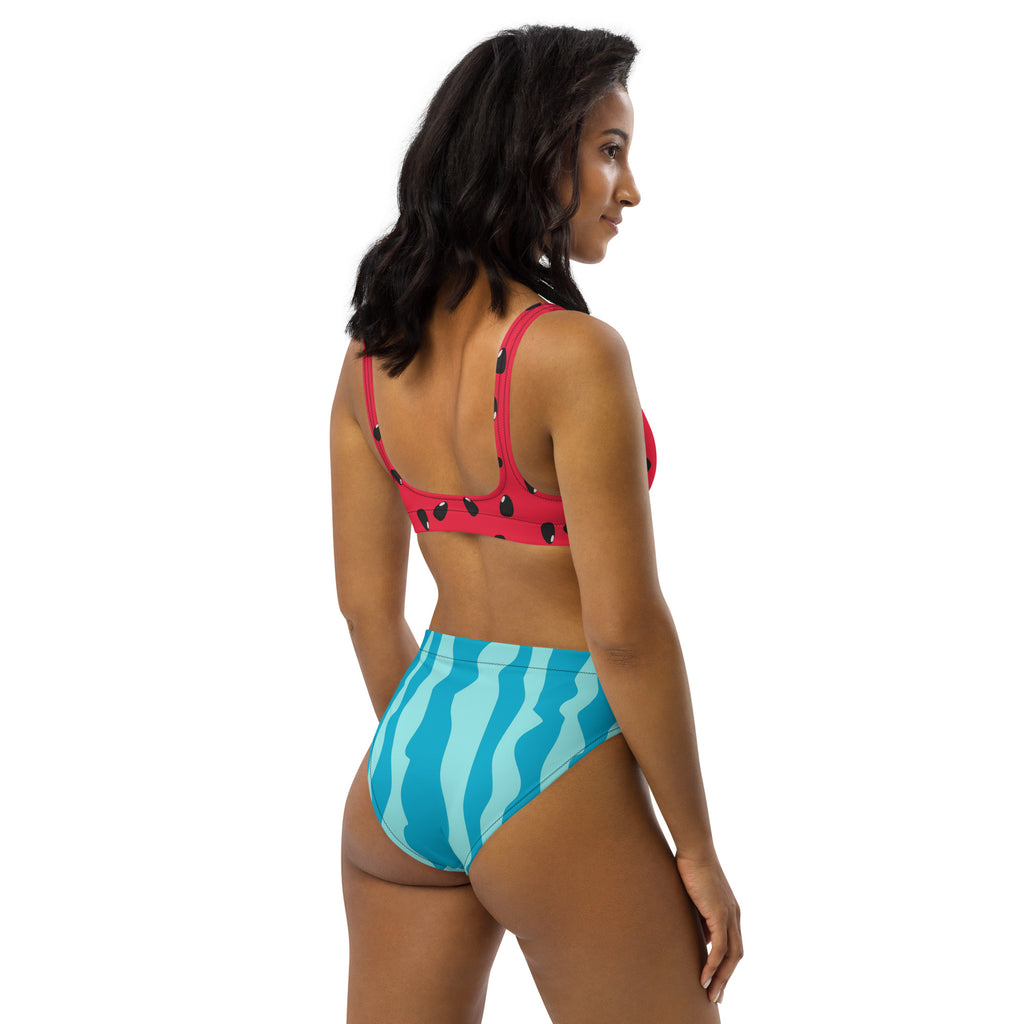 A vibrant pink and black polka dot padded bikini top with a high-waisted turquoise striped bottom in quick drying fabric with UPF 50+