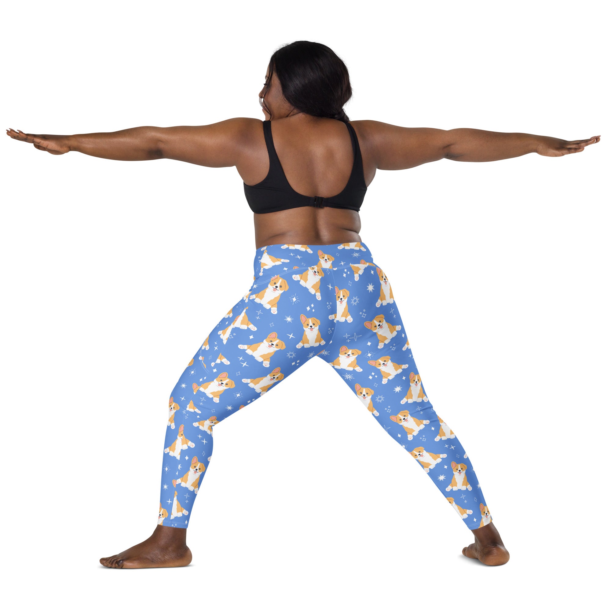 Women’s high-waisted blue yoga leggings with soft compression, pockets, and playful corgi dog and snowflake pattern