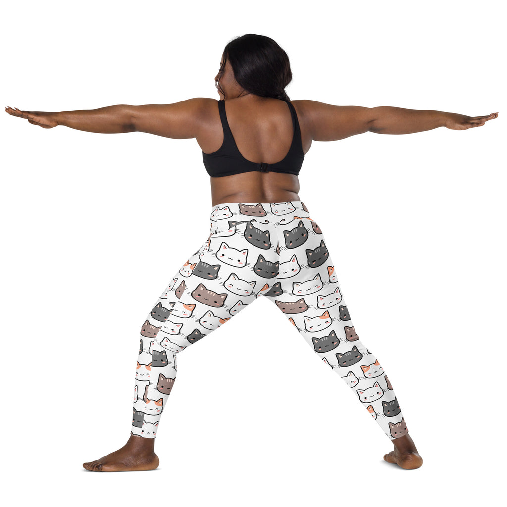 White women’s high-waisted yoga leggings with soft compression featuring colorful cartoon cat patterns and pockets