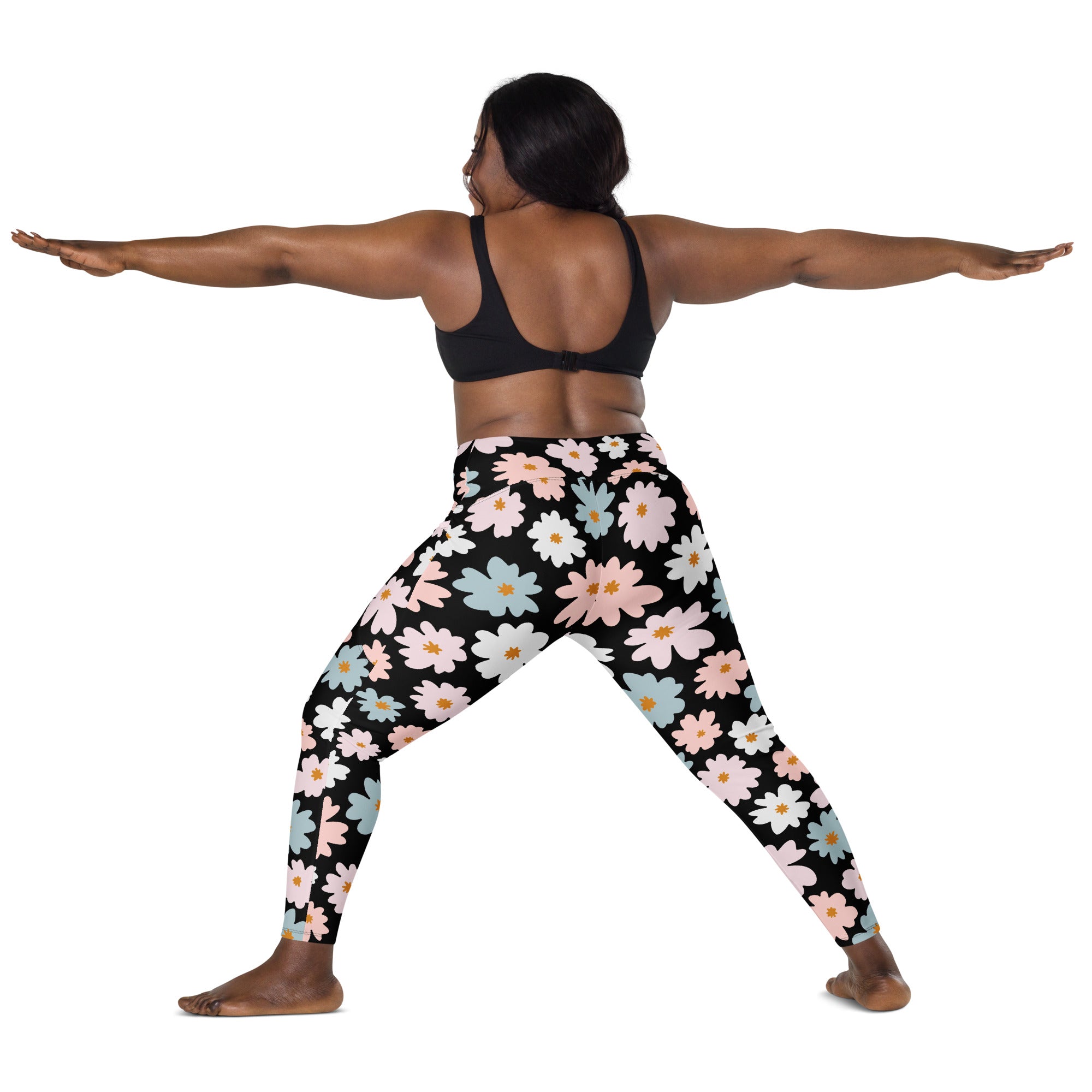 Women’s retro floral yoga leggings with pockets in black featuring pink white and light blue daisies with yellow centers