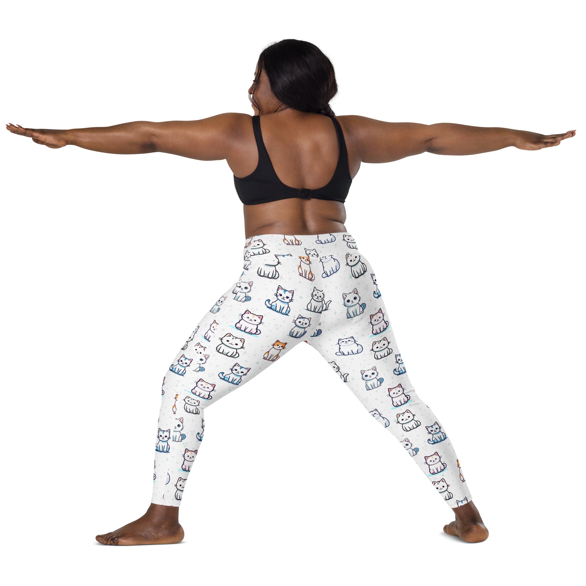 Women’s white high-waisted yoga leggings with pockets featuring colorful cartoon cats and soft compression fabric