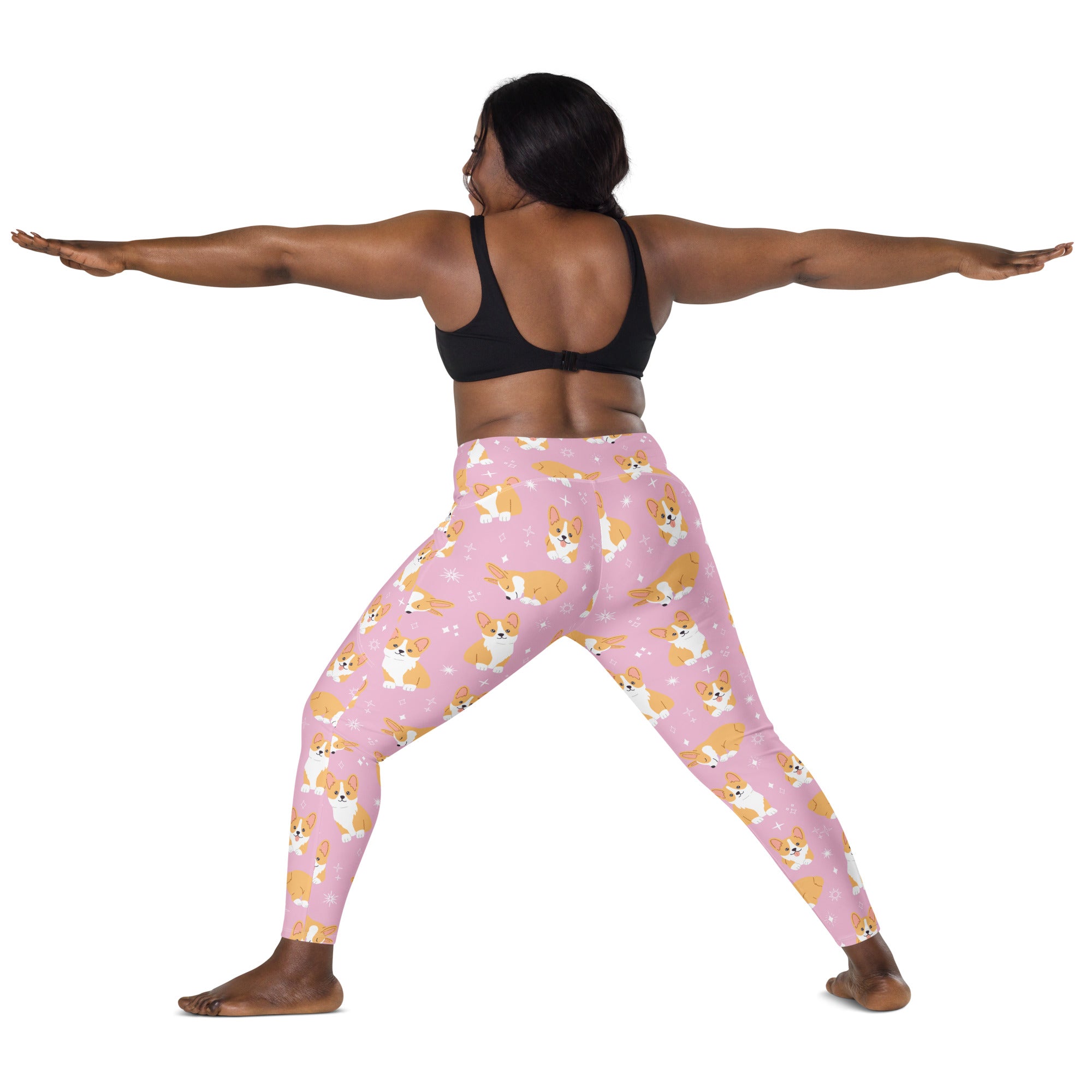 Women’s pink high-waisted yoga leggings with pockets featuring playful cartoon corgis and white star patterns