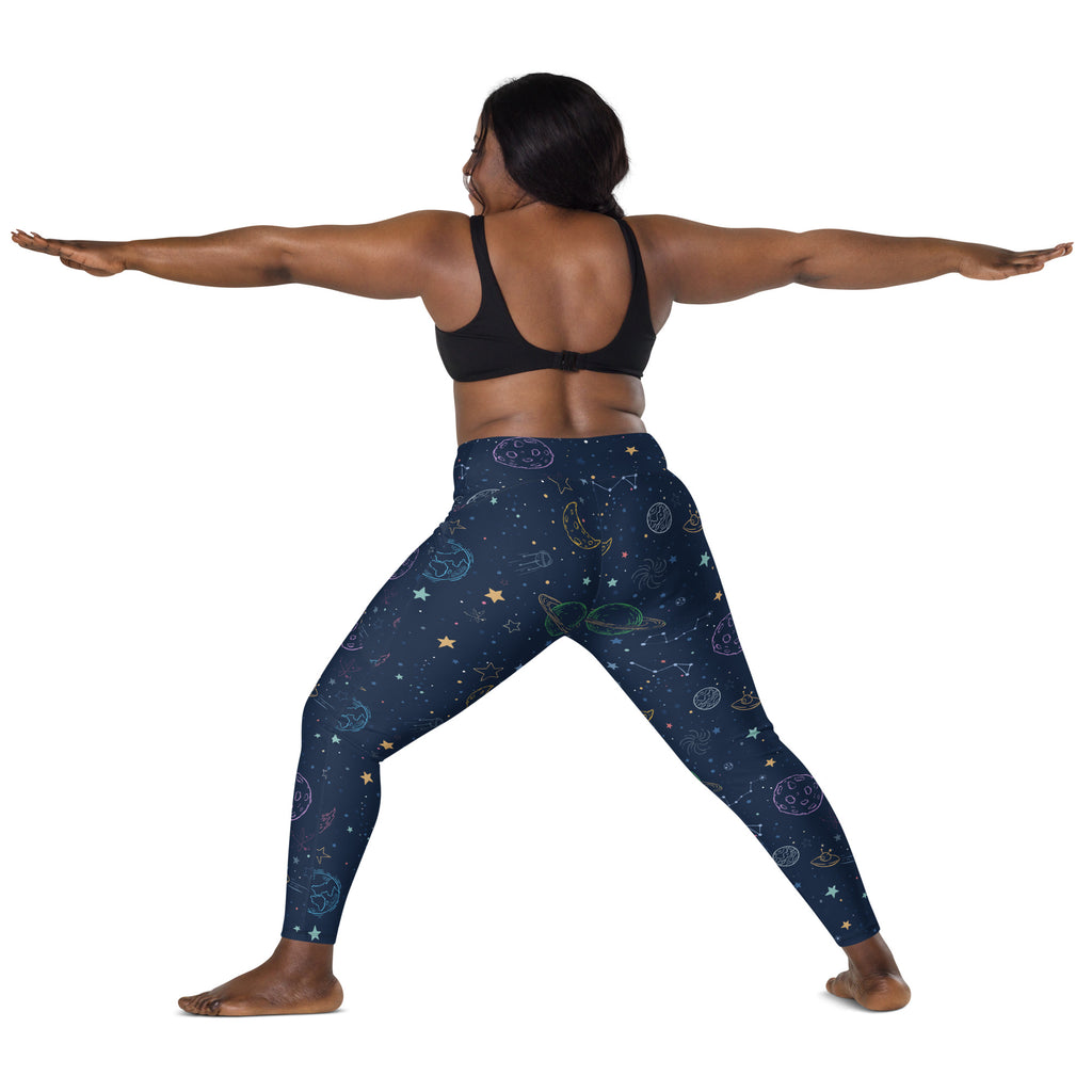 Women’s high-waisted dark blue space-themed yoga leggings with soft compression and pastel celestial patterns