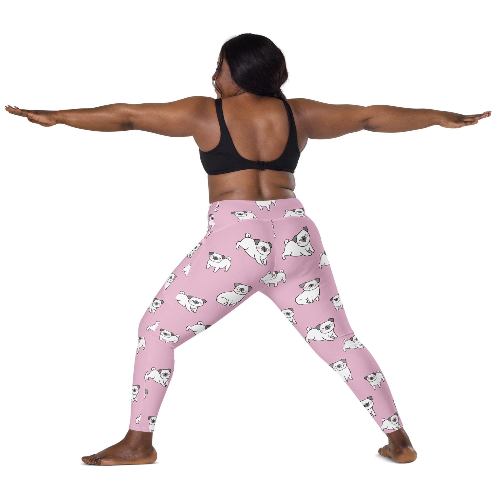 Women’s pink high-waisted yoga leggings with pockets and soft compression featuring white pug illustrations