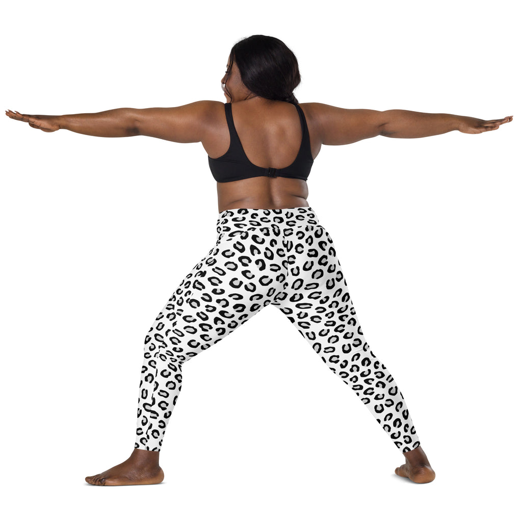 Women’s high-waisted white leopard print yoga leggings with black spots soft compression and pockets
