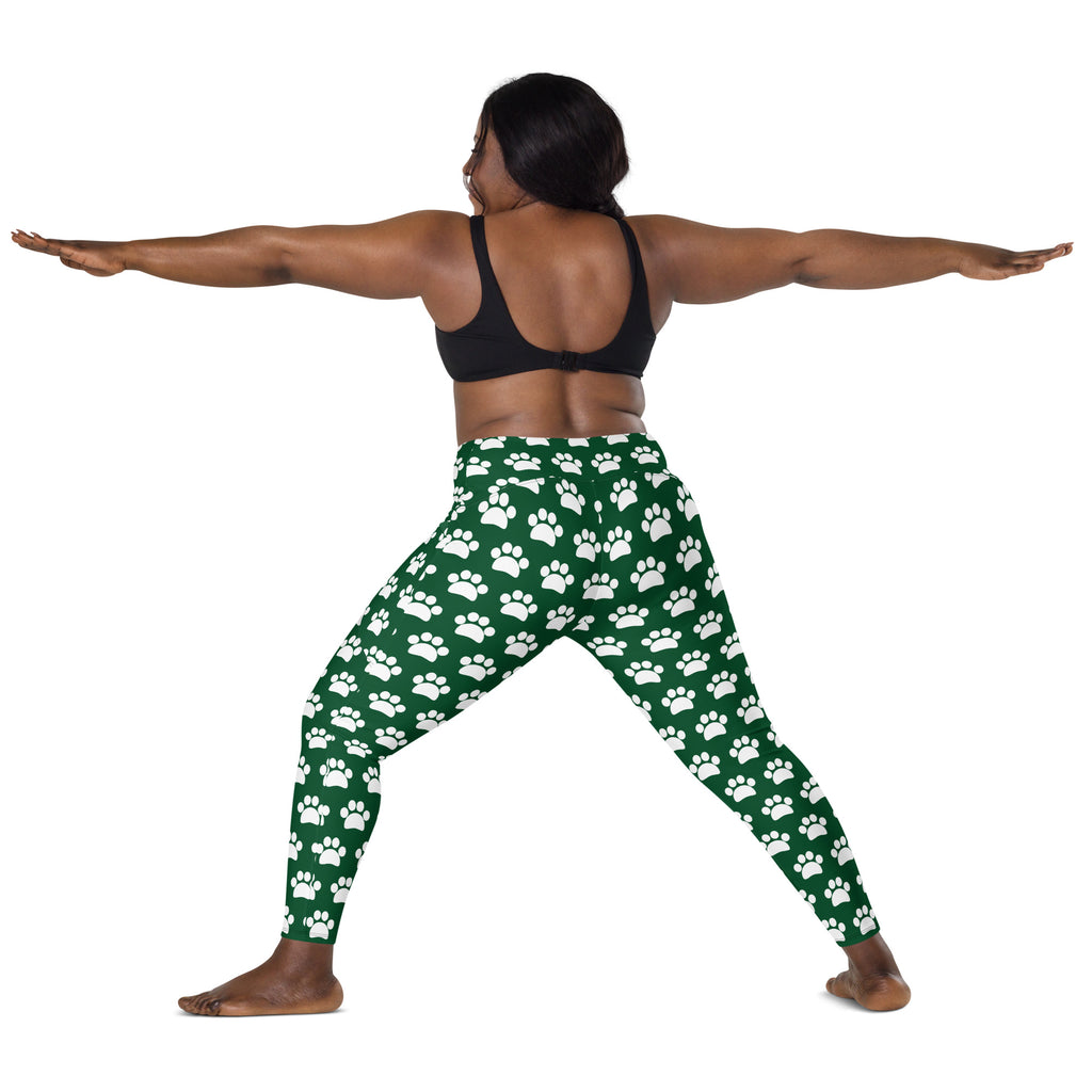 Women’s green high-waisted yoga leggings with soft compression and white paw print pattern with pockets