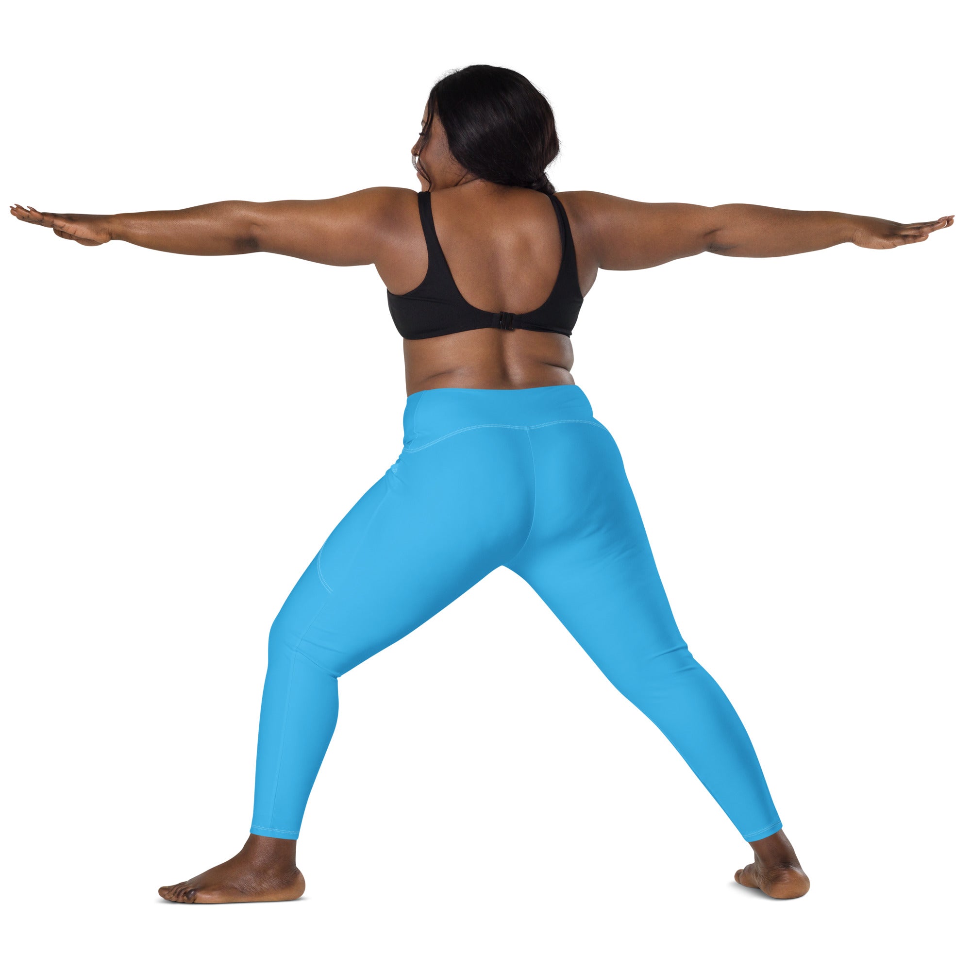 Bright blue high-waisted women’s yoga leggings with pockets made of soft compression fabric for active wear