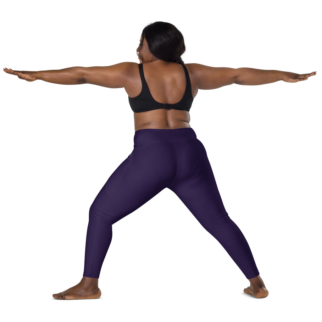 Women’s dark purple high-waisted yoga leggings with pockets made of soft compression fabric shown from the back side