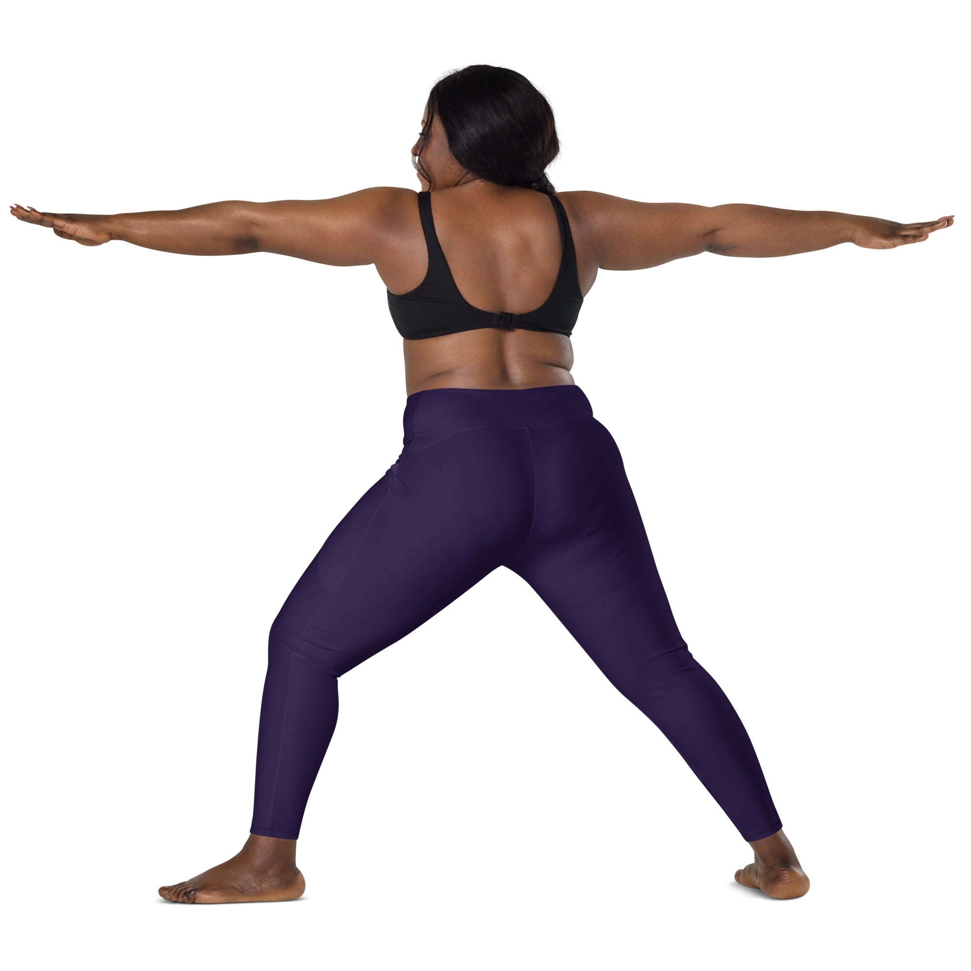 Women’s dark purple high-waisted yoga leggings with pockets made of soft compression fabric shown from the back side