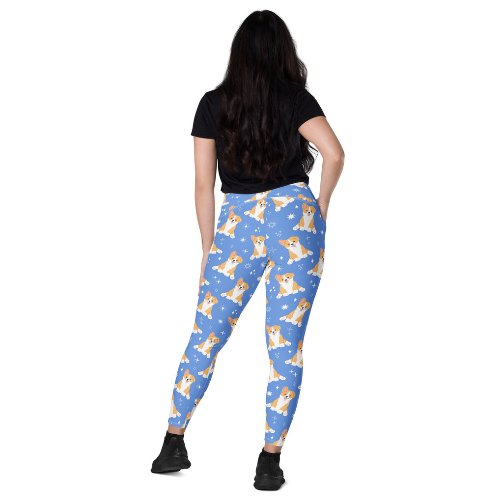 Women’s blue high-waisted yoga leggings with soft compression and pockets featuring tan and white corgi puppy pattern