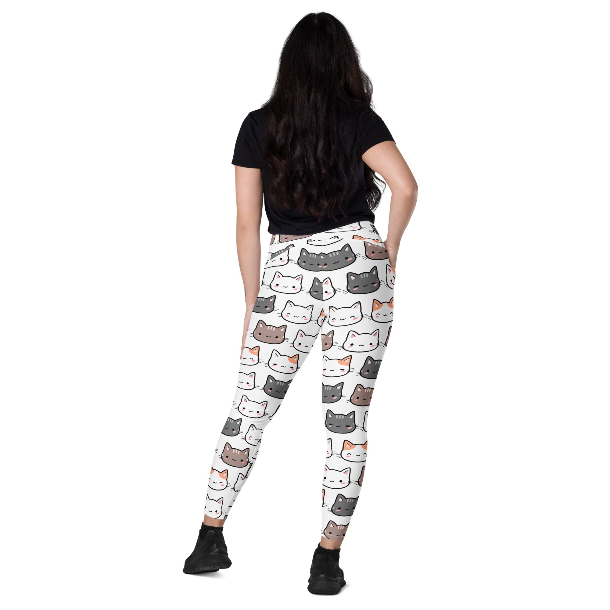 White high-waisted leggings with pockets featuring a playful multicolor cartoon cat pattern for yoga and active wear