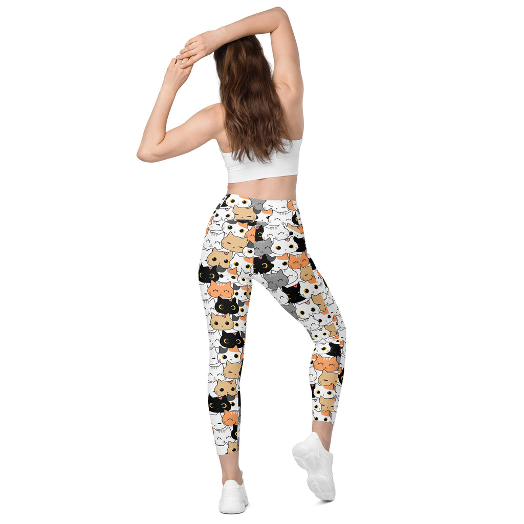 White women’s high-waisted cat face yoga leggings with pockets featuring colorful playful cartoon cat print