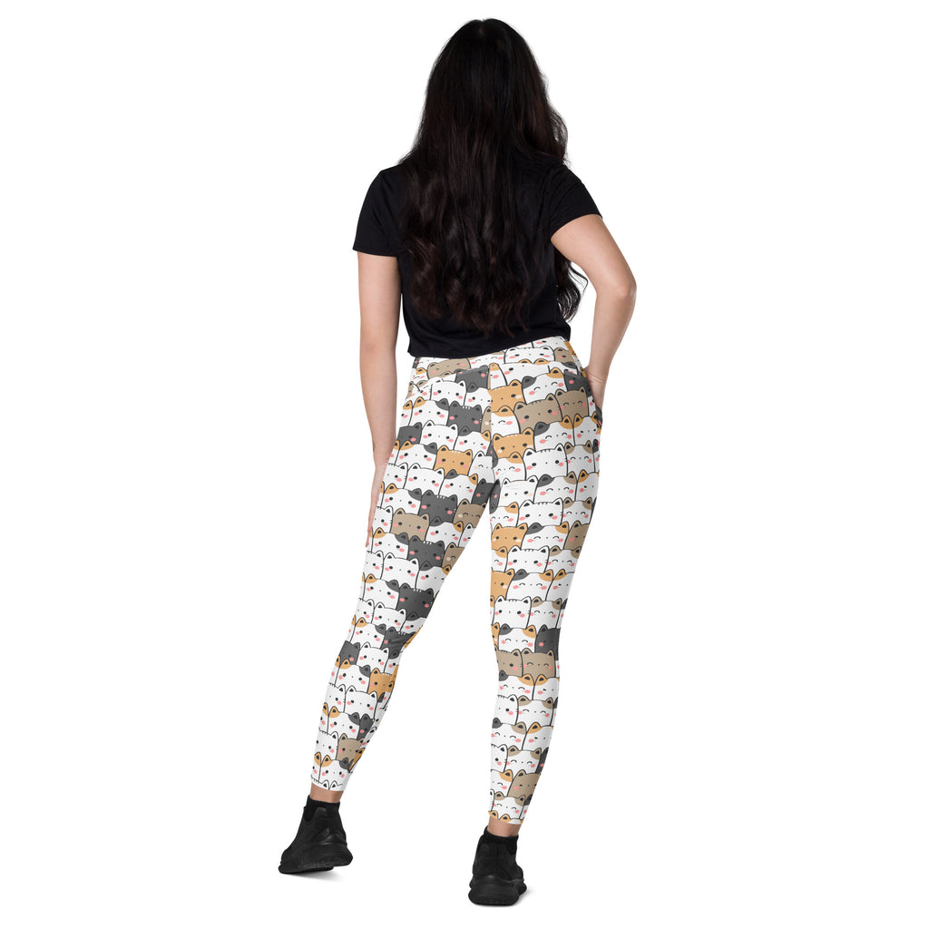 White kawaii cat yoga leggings with pockets featuring playful multicolor cartoon cats in soft compression fabric
