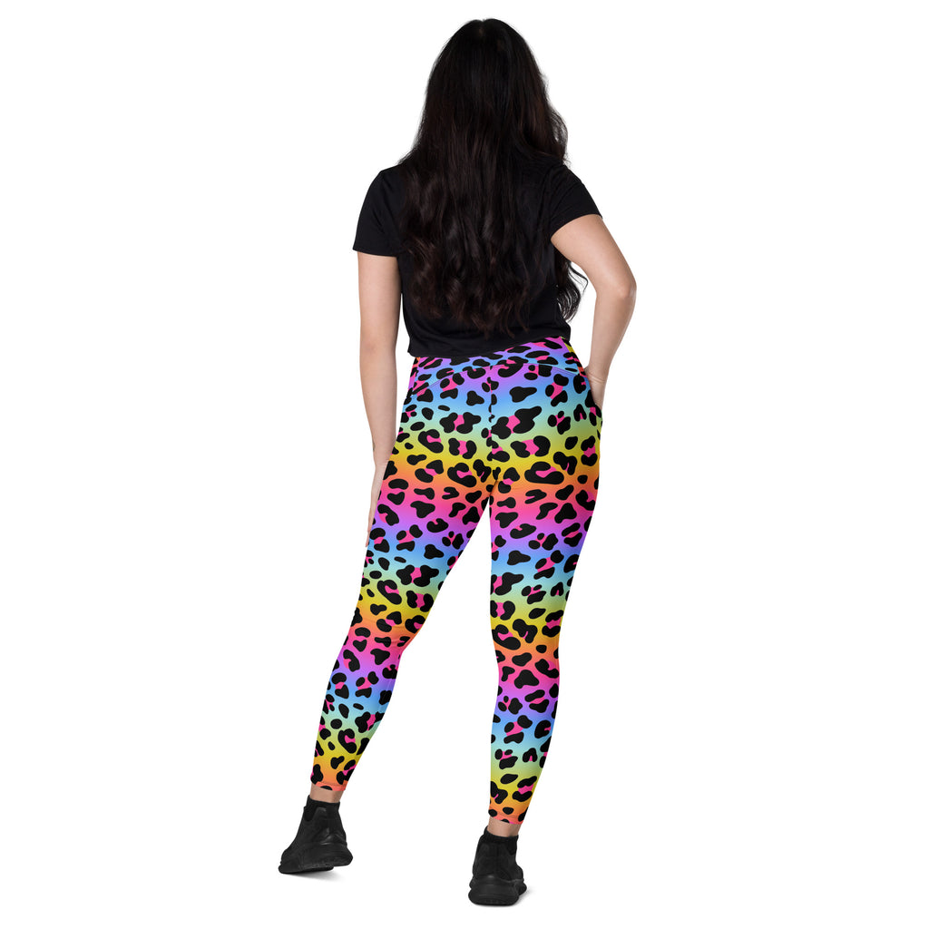 Women’s high-waisted rainbow leopard yoga leggings with pockets in soft compression fabric gradient pink to blue