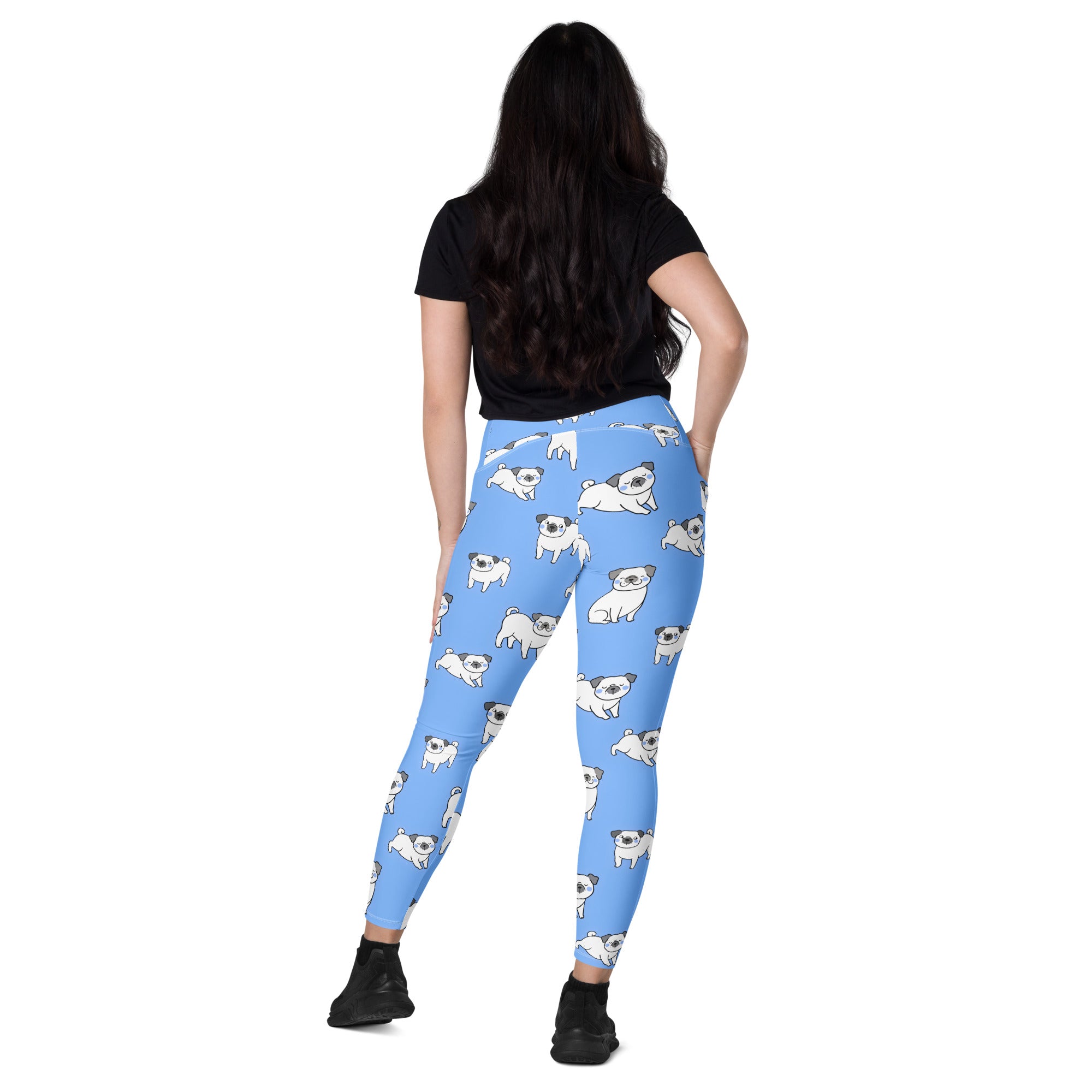 Women’s light blue high-waisted yoga leggings with pockets featuring playful white pug dog pattern and soft compression material
