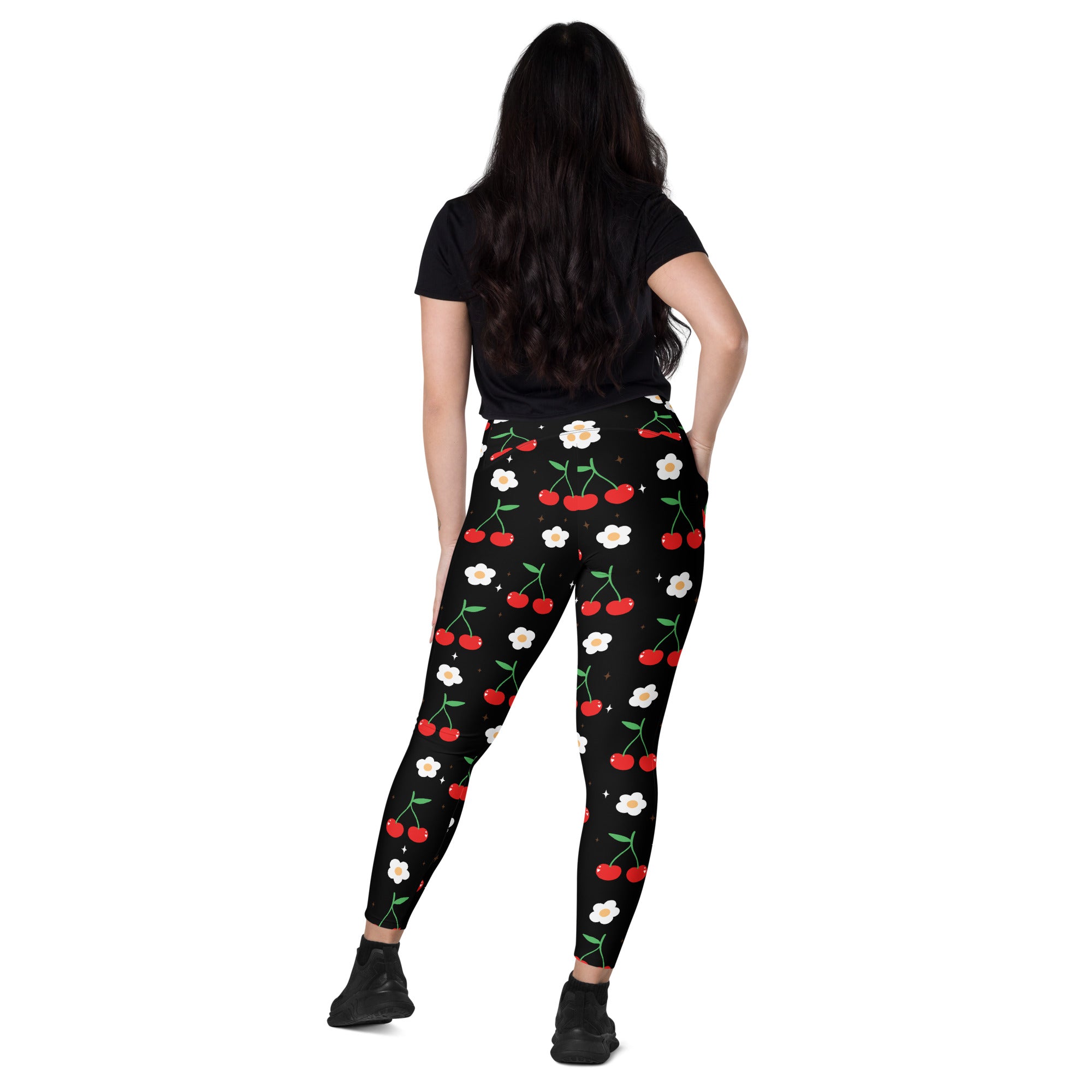 Women’s black high-waisted cherry print yoga leggings with pockets featuring red cherries green stems and white flowers