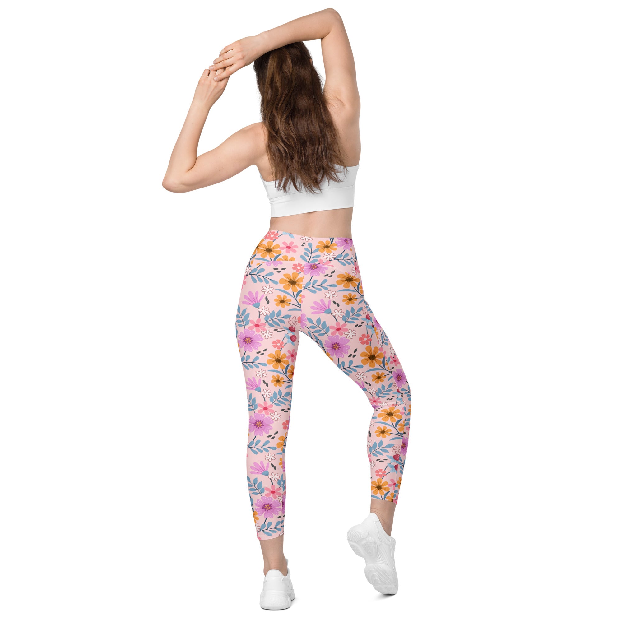 Women’s pink floral yoga leggings with pockets high-waisted soft compression fabric and orange purple blossoms