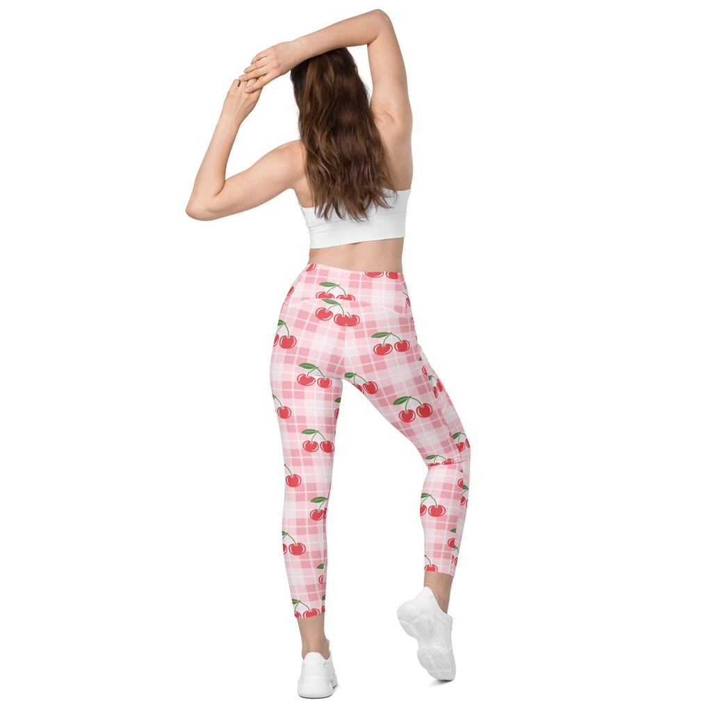 Women’s high-waisted pink and white plaid cherry gingham yoga leggings with pockets and soft compression fabric