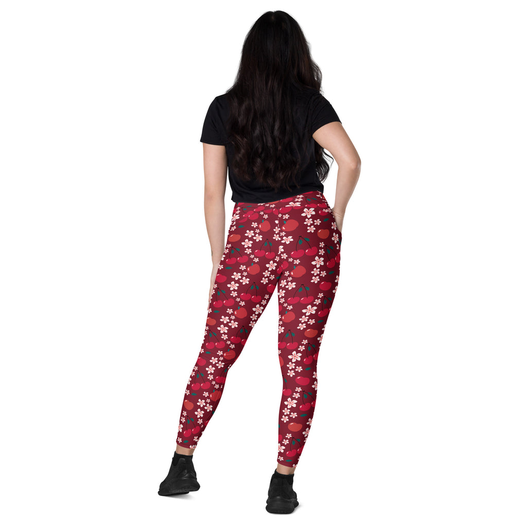 Women’s high-waisted cherry blossom yoga leggings with pockets in red cherry and white flower pattern for active wear