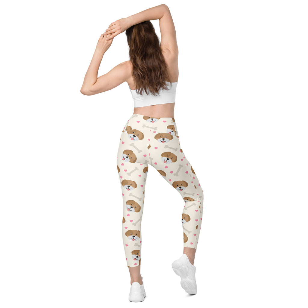 Cream-colored women’s cute dog yoga leggings with pockets featuring brown puppy faces and bones high-waisted soft compression