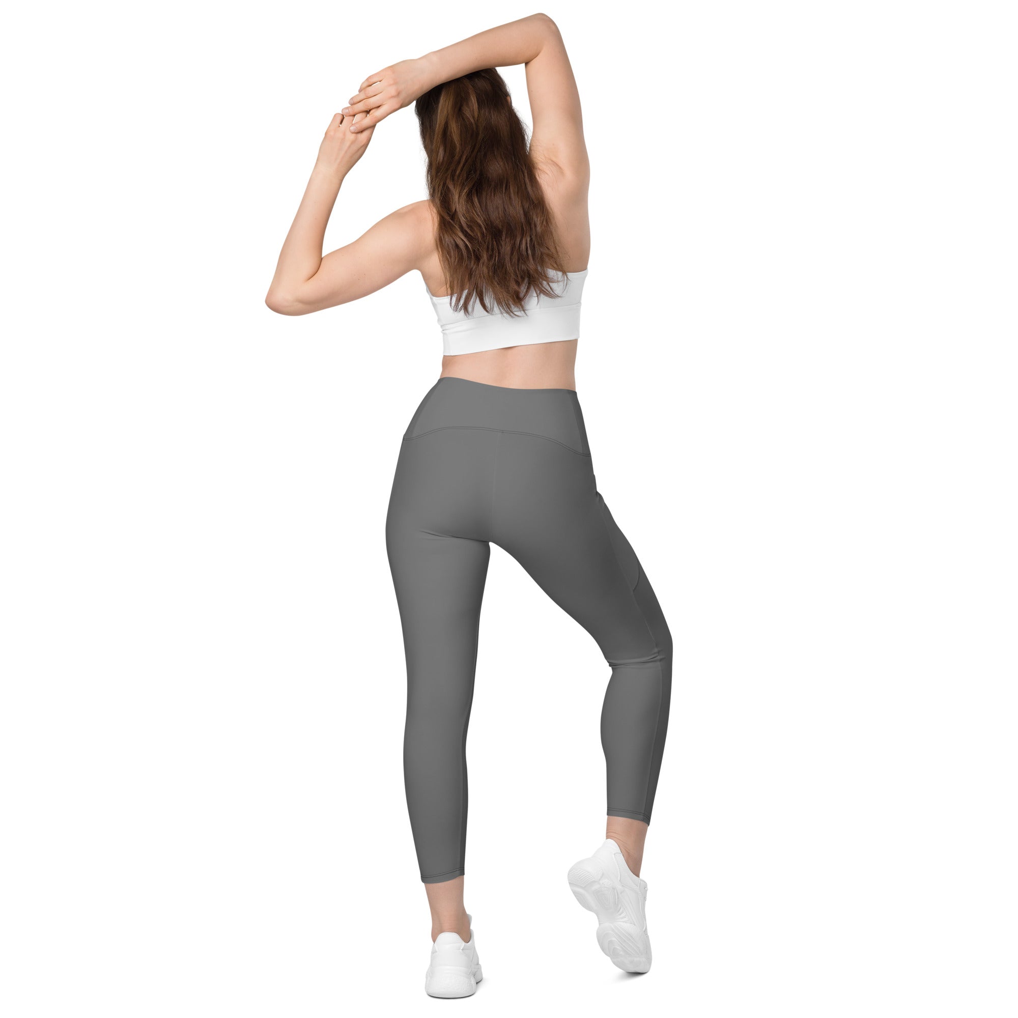 Women’s gray high-waisted yoga leggings with pockets made of smooth stretchy seamless fabric for soft compression