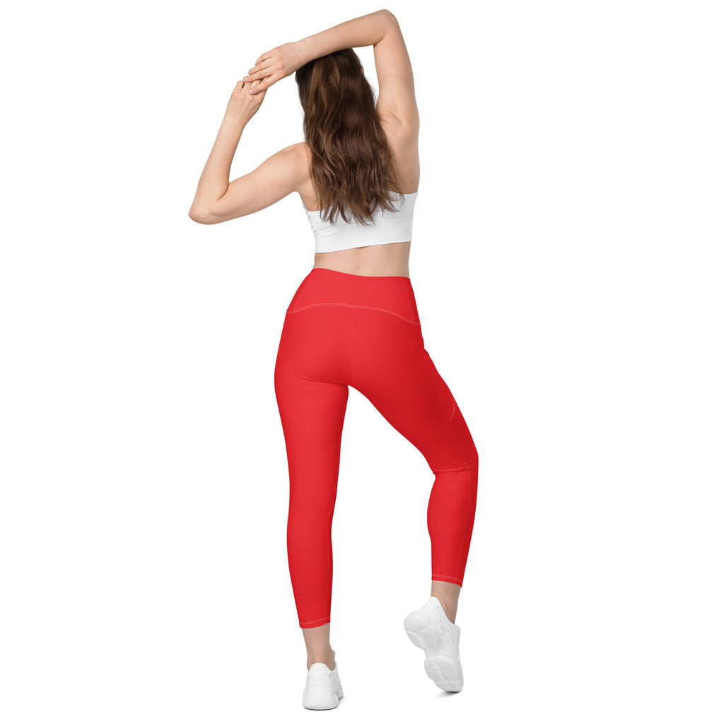 Women’s red high-waisted yoga leggings with pockets soft compression fabric and sleek form-fitting design