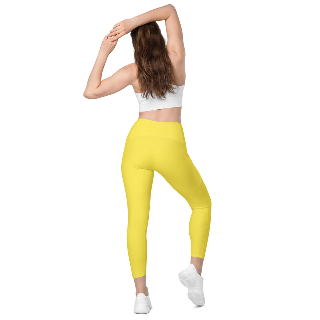Women’s yellow high-waisted yoga leggings with pockets made of smooth stretchy soft compression fabric