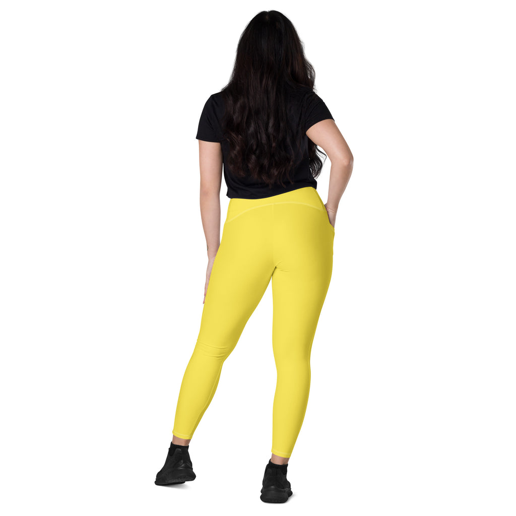 Women’s bright yellow high-waisted yoga leggings with pockets soft compression fabric for activewear use