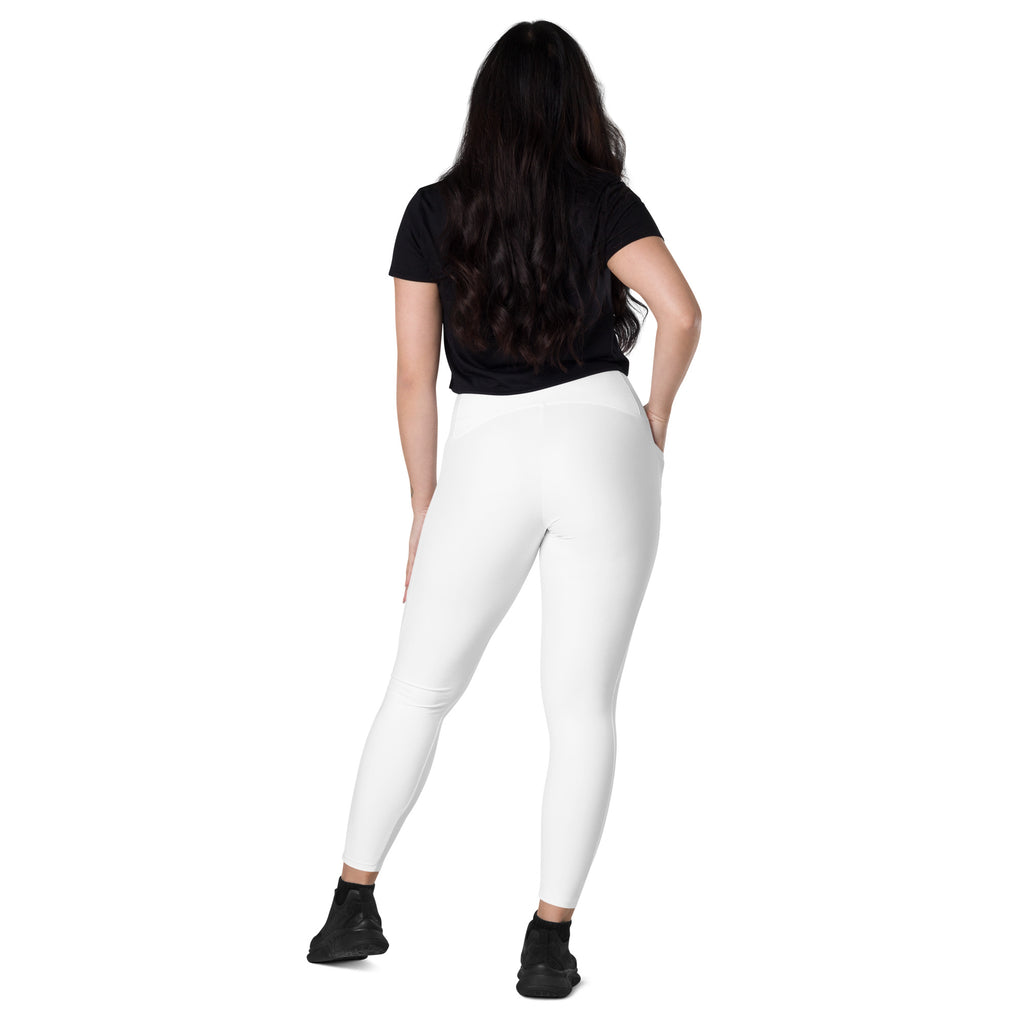 Women’s white high-waisted yoga leggings with pockets made from smooth, form-fitting stretch fabric for soft compression