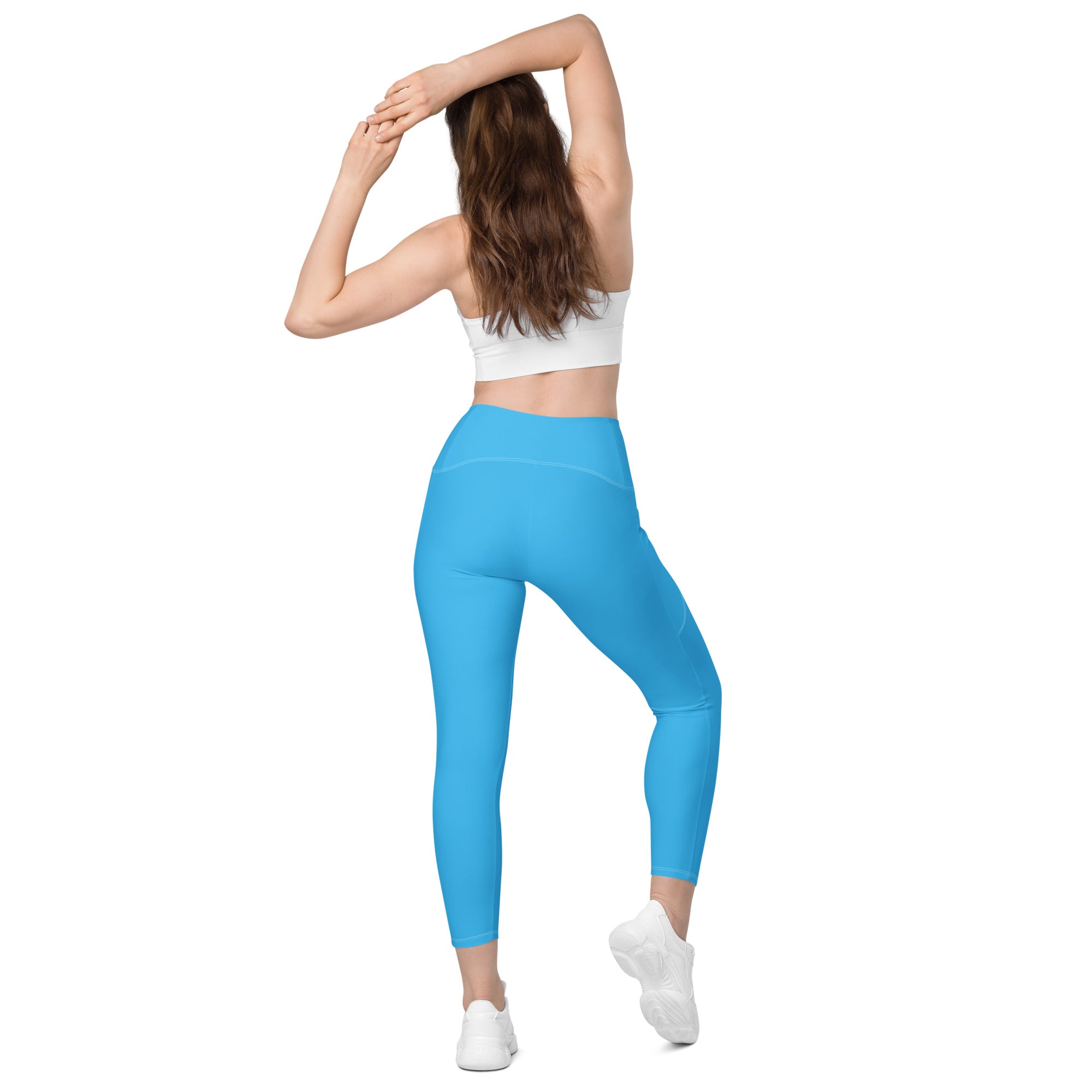 Women’s blue high-waisted yoga leggings with pockets made of smooth stretchy fabric for soft compression and active wear