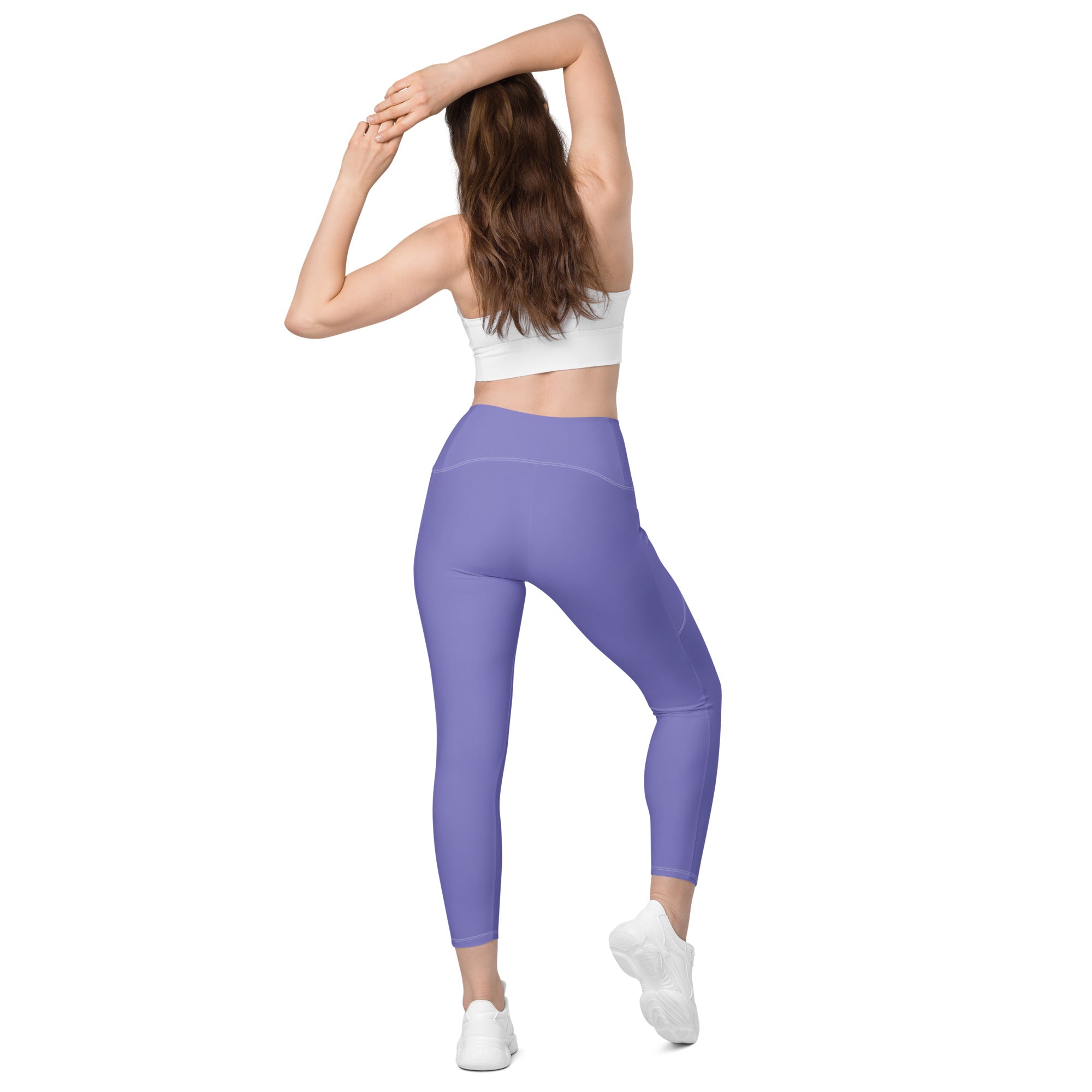 Women’s lavender high-waisted yoga leggings with pockets made from soft compression stretchy fabric with subtle seams