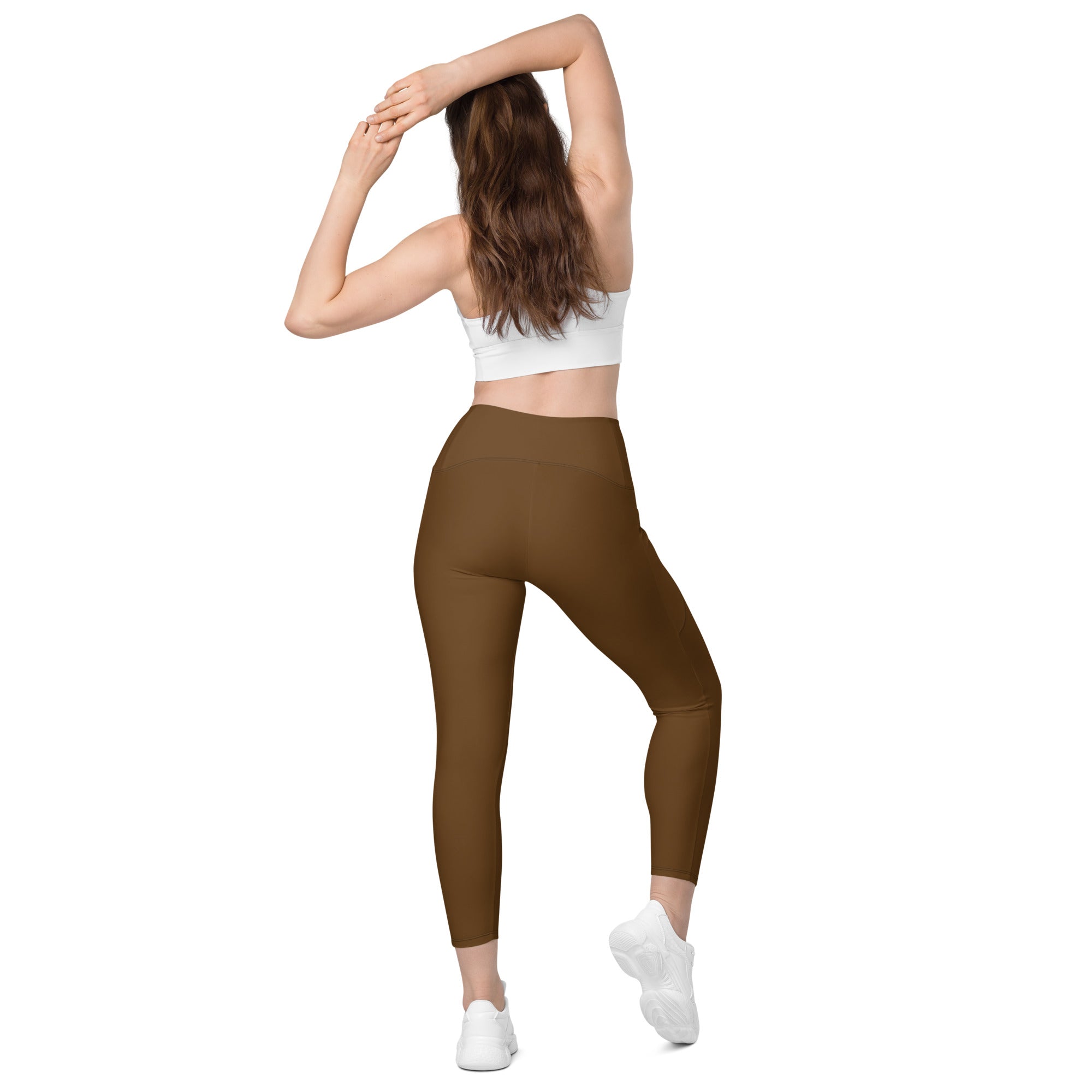 Women’s brown high-waisted yoga leggings with pockets made from smooth stretchy fabric for soft compression and active wear