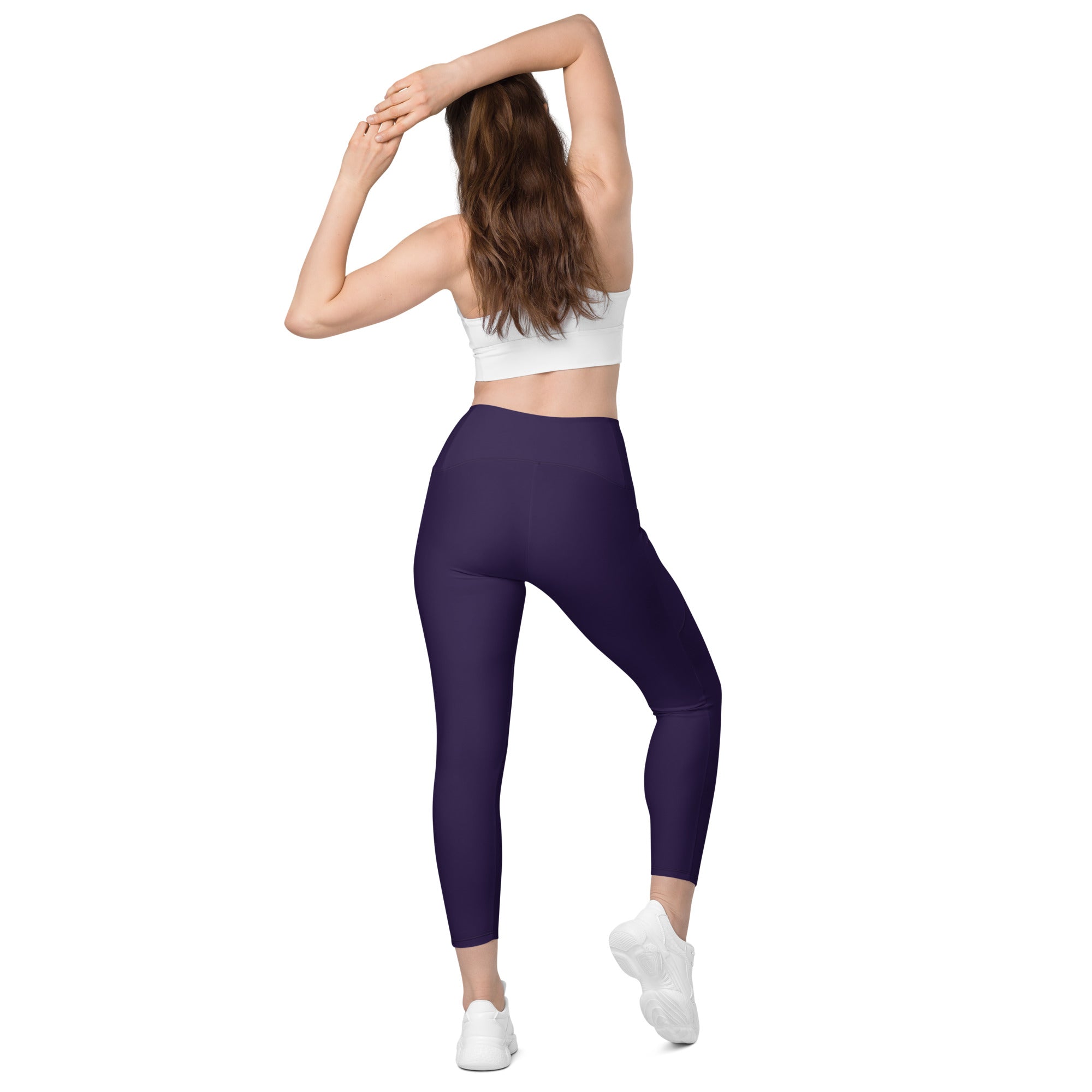 Women’s dark purple high-waisted yoga leggings with pockets made of smooth stretchy fabric for soft compression