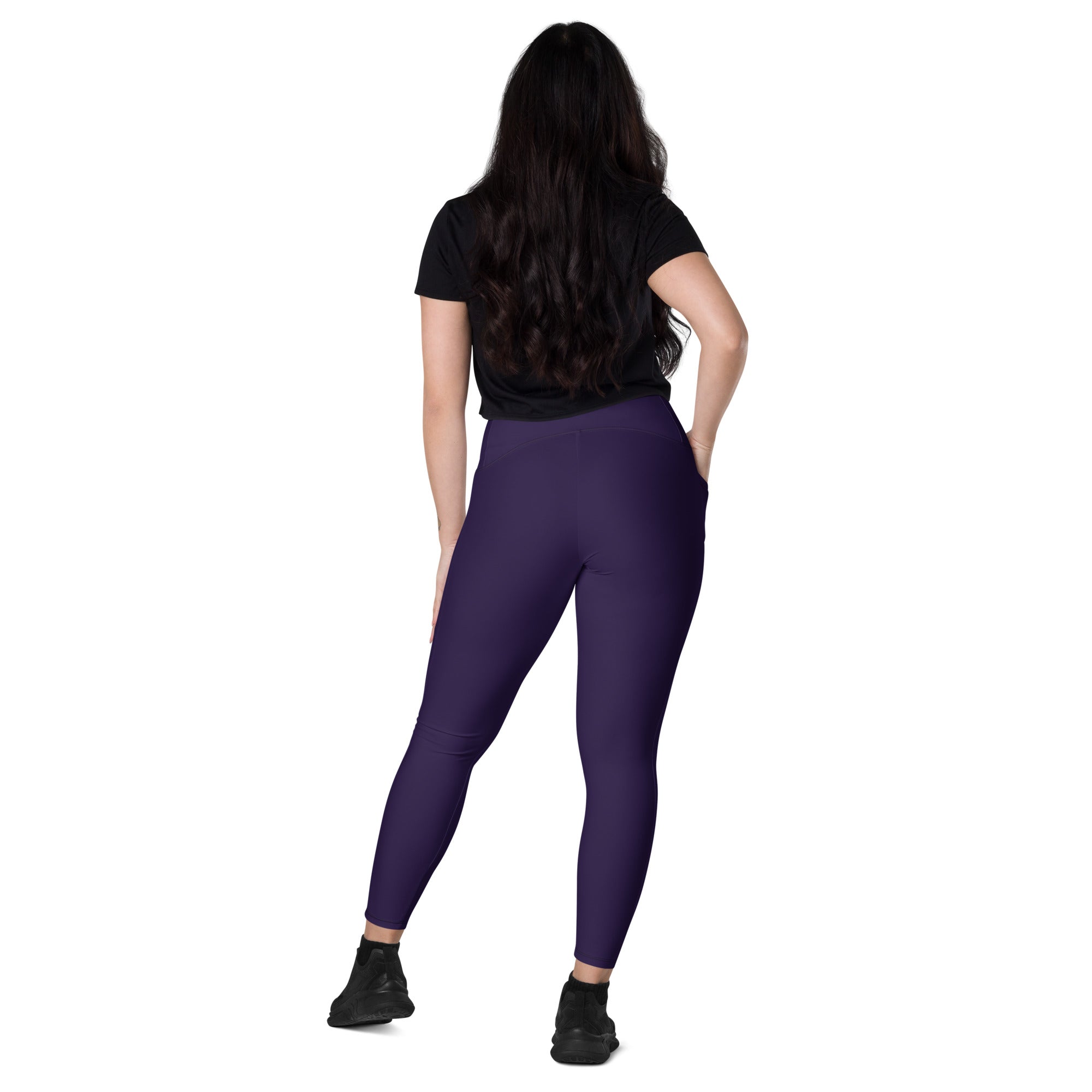 Women’s dark purple high-waisted yoga leggings with pockets made of soft compression fabric for activewear