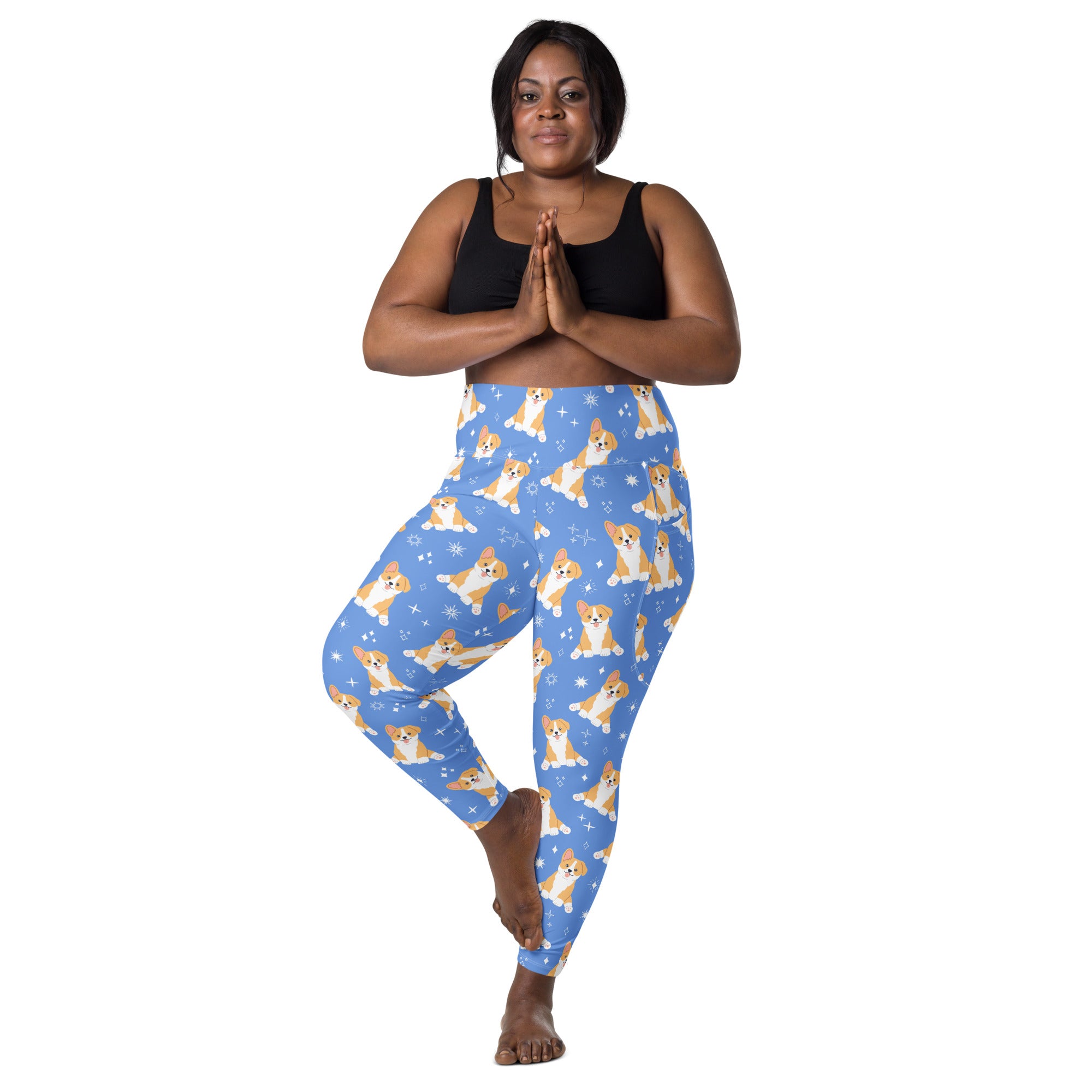 Women’s blue high-waisted corgi dog yoga leggings with pockets featuring tan and white corgi pattern and star accents