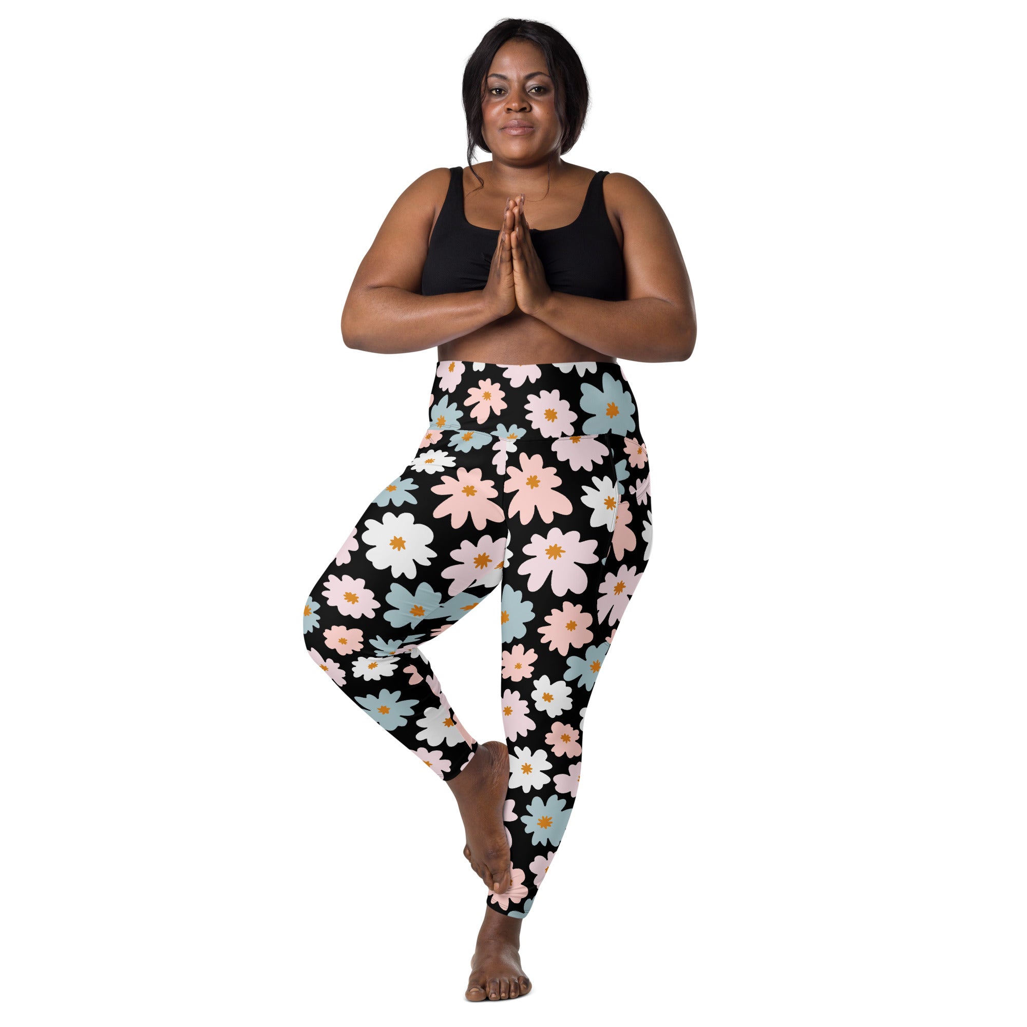 Women’s retro floral high-waisted yoga leggings in black with soft compression and vibrant pink white blue flower pattern