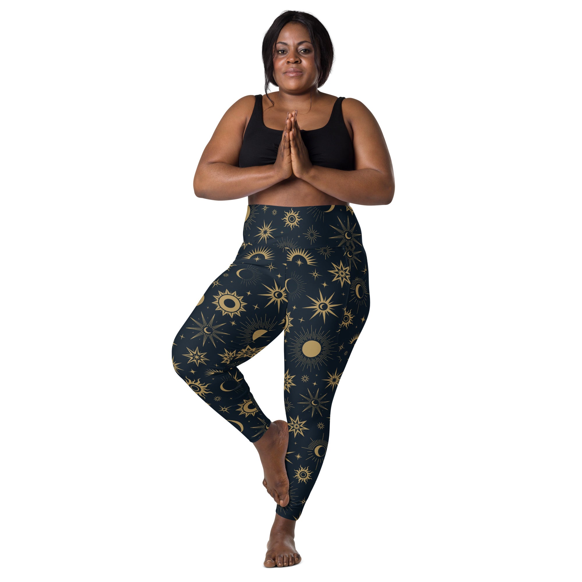 Dark blue high-waisted yoga leggings with vibrant gold celestial sun moon and star pattern soft compression pants with pockets
