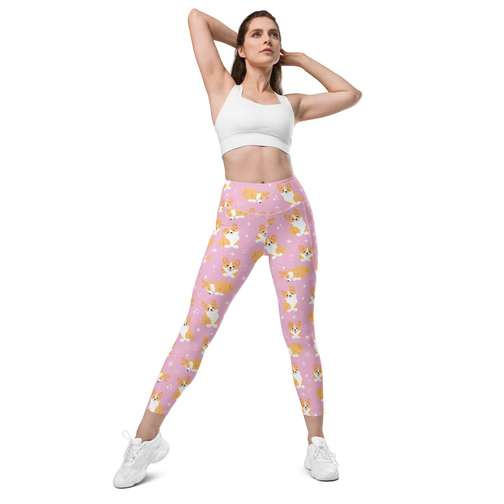 Women’s pink high-waisted yoga leggings with pockets featuring a soft compression fabric and cartoon corgi pattern