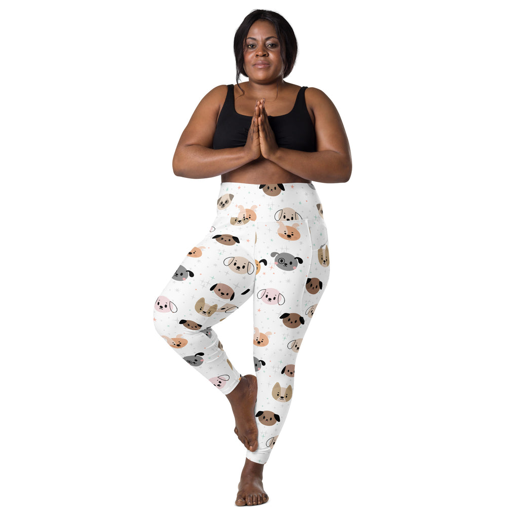 White women’s high-waisted yoga leggings with playful multicolored cartoon dogs and soft compression fabric with pockets