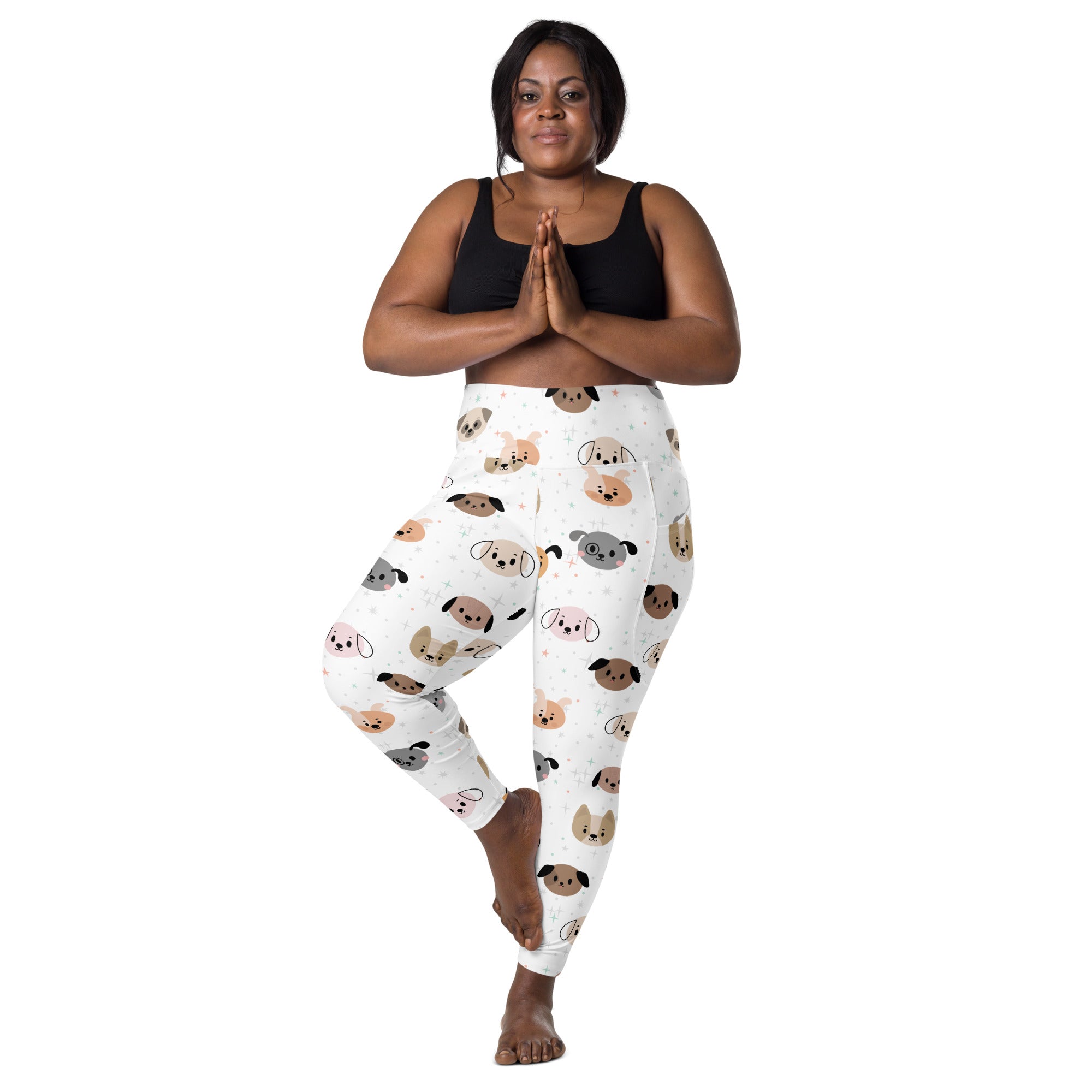 White women’s high-waisted yoga leggings with playful multicolored cartoon dogs and soft compression fabric with pockets