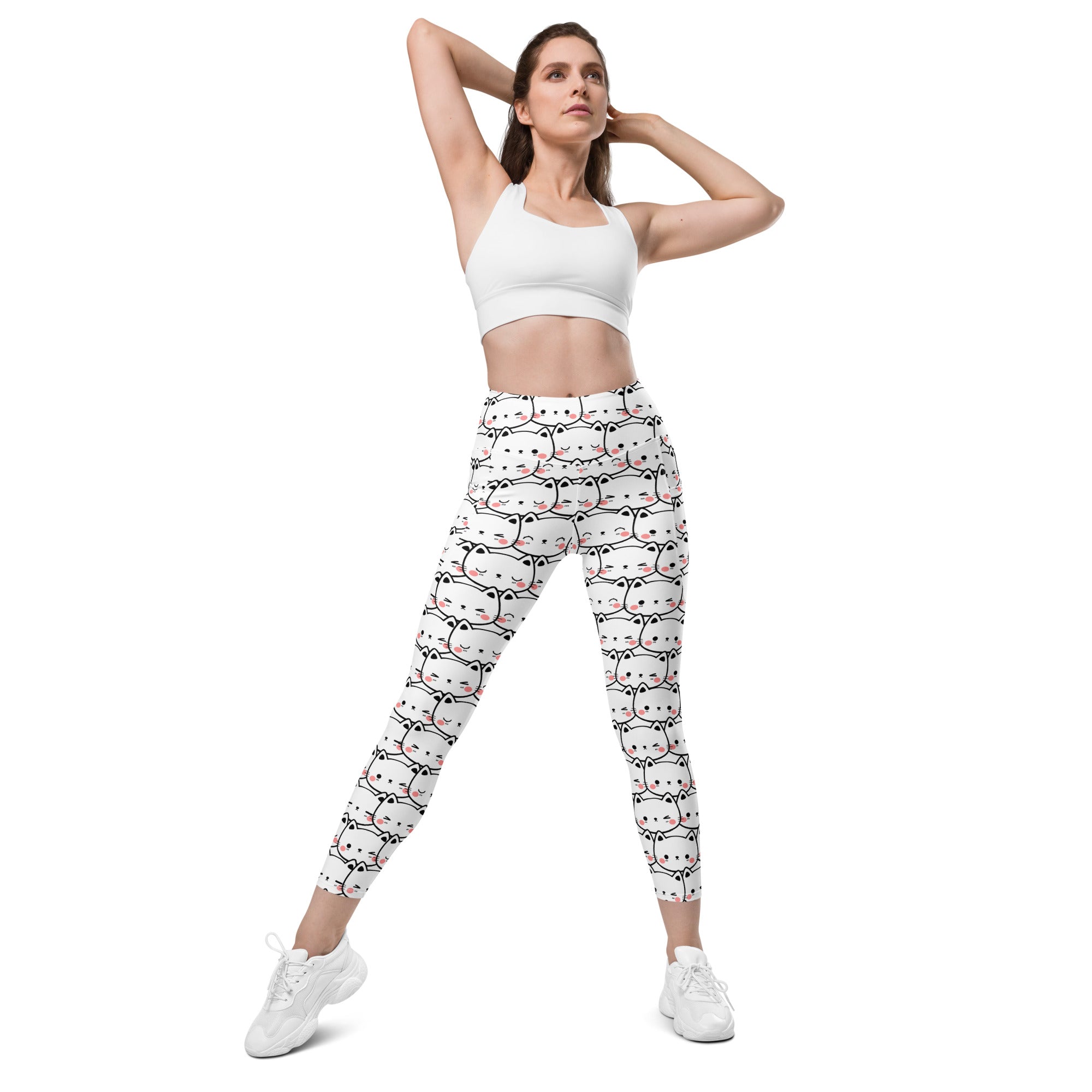 White women’s kawaii cat face yoga leggings with pockets featuring black outlined cartoon cats and pink blush marks